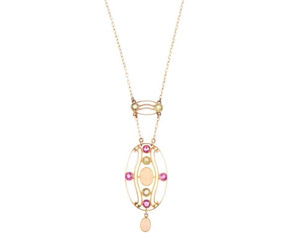 GEMMOLOGIST'S NOTES
This breathtaking early 20th century necklet was exquisitely crafted during the Arts and Crafts era. Offering alliance to the Suffragette movement, this necklace is carefully created using the pink, green and white of their
