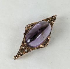 Broche Floral Arts and Crafts Amythest Cab