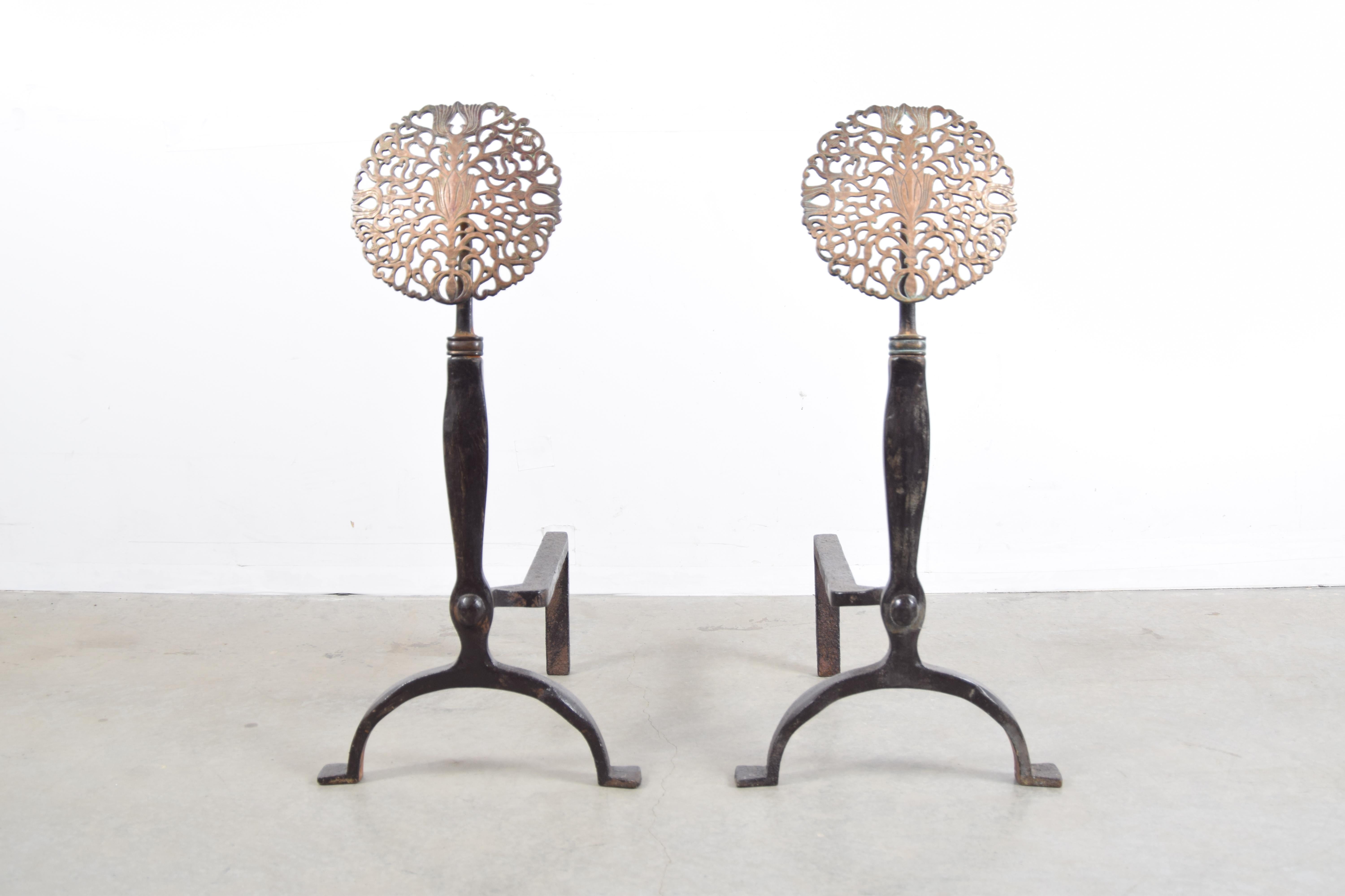 Iron and bronze andirons, circa 1915, in the style of Ernest Gimson. Andirons measure 27 1/4