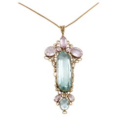 Antique Arts and Crafts aquamarine and pink topaz pendant in yellow gold