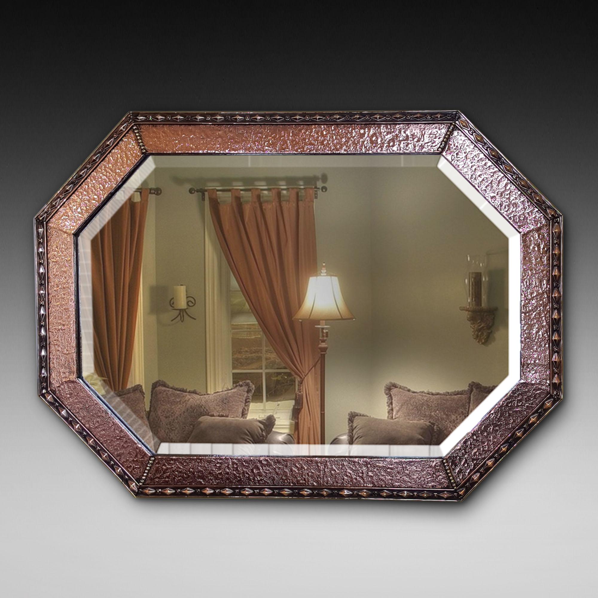 Arts & Crafts beaten copper and brass mirror, circa 1890. Measures: 34