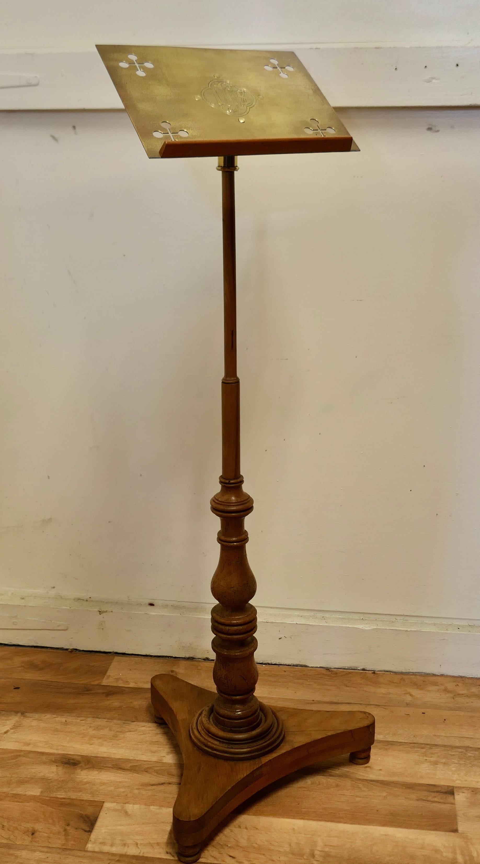 Arts and Crafts beech and brass menu podium, reading stand.

This is a charming piece full of character, the book frame at the top is in brass in the Arts and Crafts style which is a good size to hold a menu it is set on a turned beech 3 footed