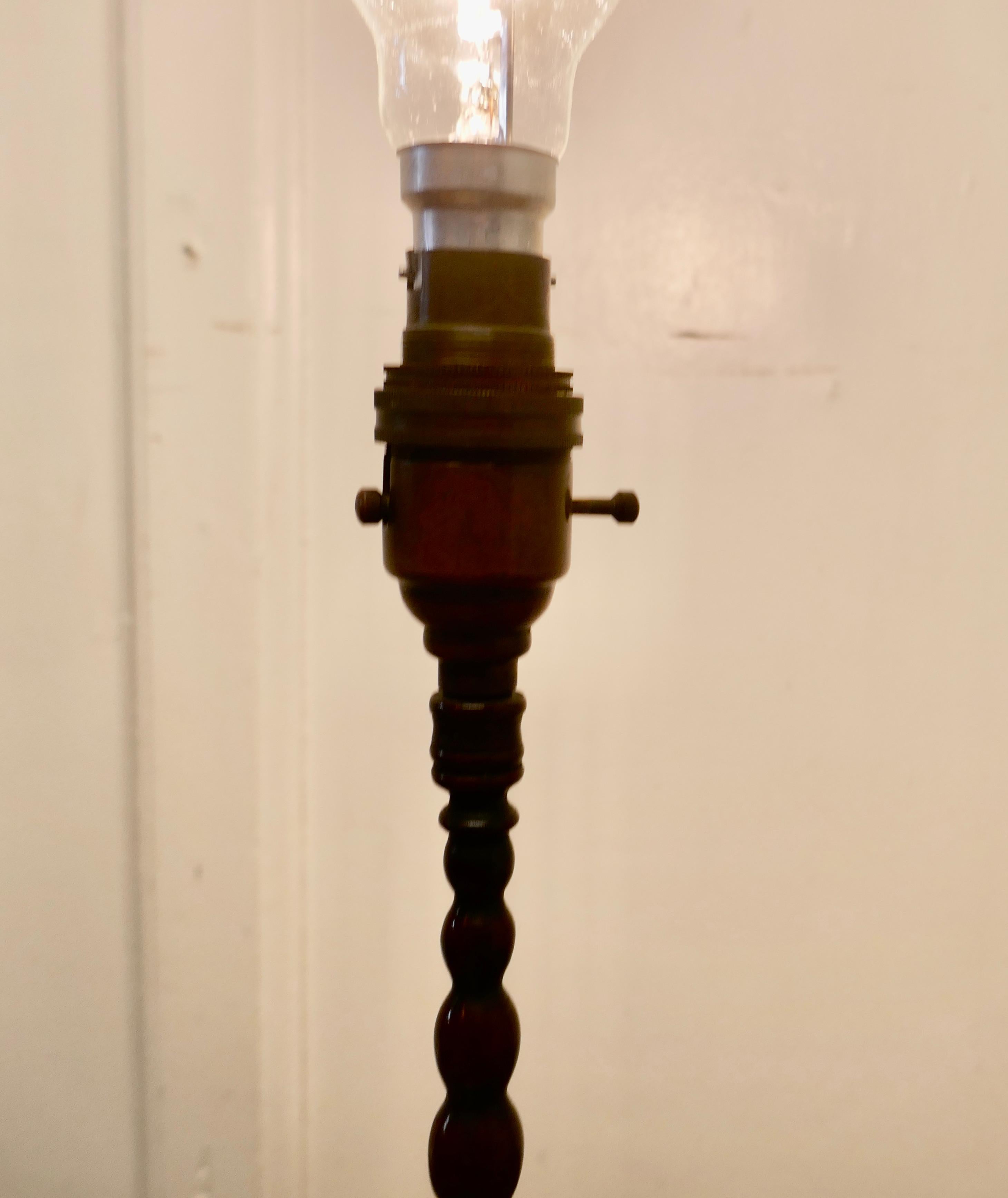 Arts and Crafts Bobbin Twist Column Copper Table Lamp 

A very pretty piece, the lamp is made in copper it has a decorative turned foot supporting a tapering bobbin turned column 
The lamp is in good condition and working
The lamp is 15” tall