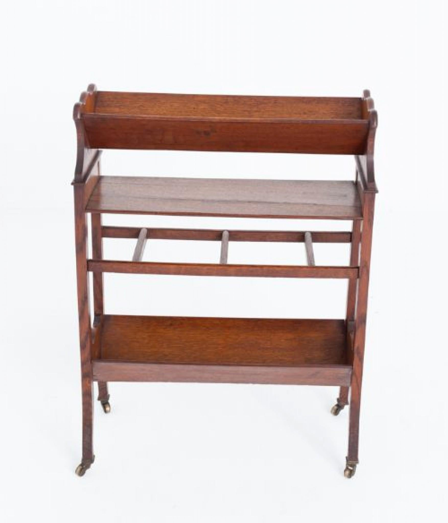 Oak Arts and Crafts book rack.
Circa 1880
This book rack being of a typical arts and crafts form.
Having shaped legs with brass castors and 2 book troughs.
Presented in good condition
