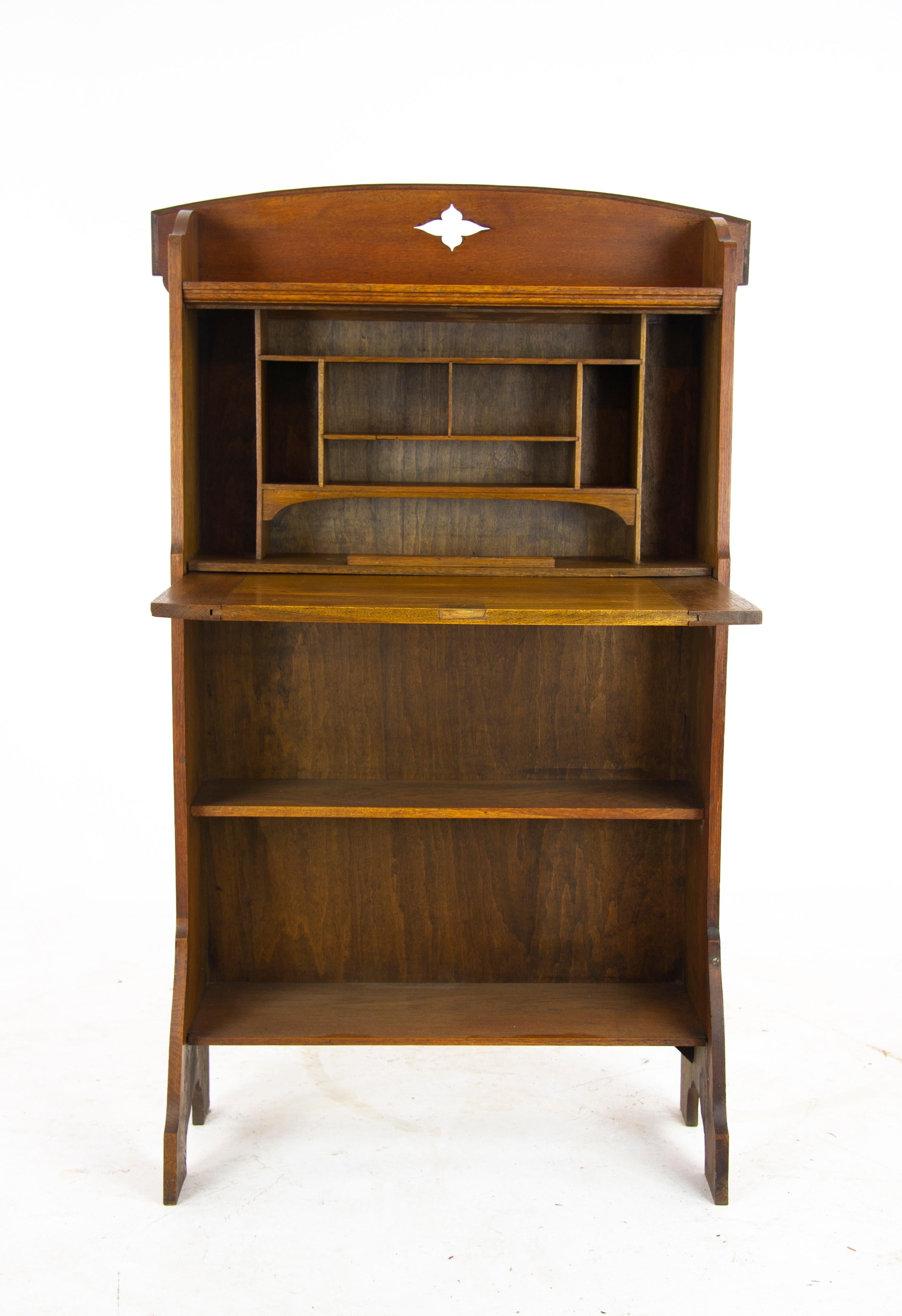 Arts & Crafts bookcase, oak bookcase, Glasgow, Scotland 1910, Antique Furniture

Scotland, 1910
Shaped gallery to the top with pierced diamond
Slanted drop front opens to reveal
Shelved interior with a flat work surface
Two fixed shelves