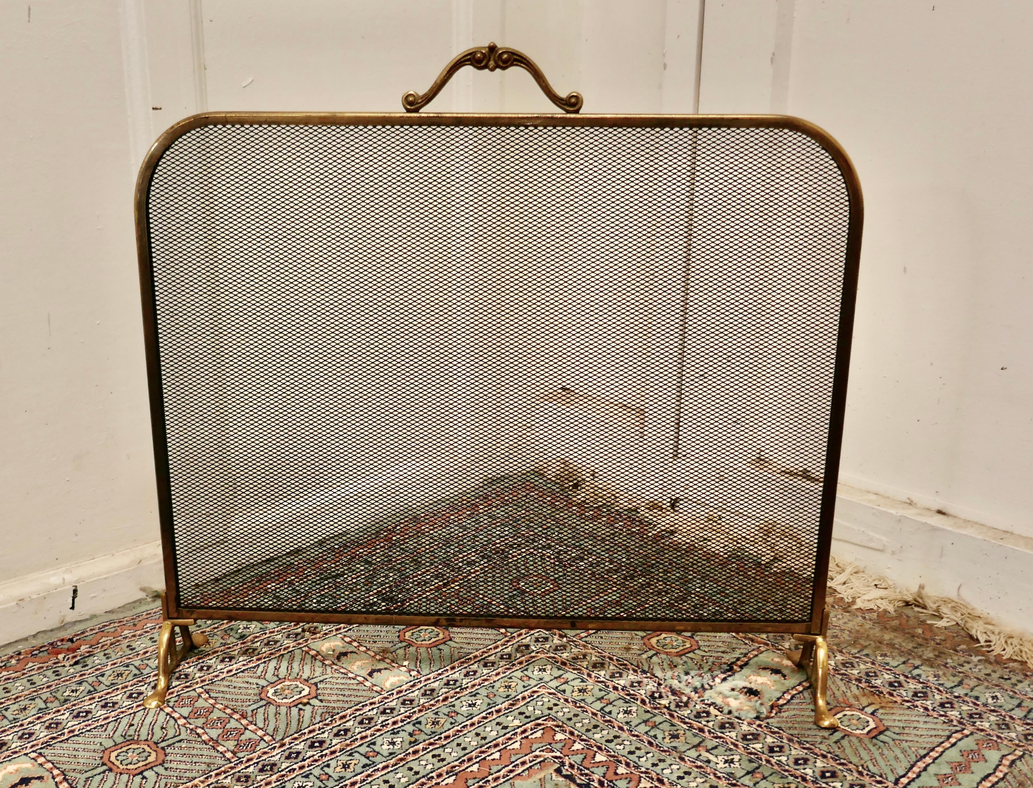 Arts and crafts brass and iron fire guard, spark screen

The Fire guard is a stylish good quality piece it is made in brass with a steel fine mesh screen and has a handle to the top
A delightful decorative piece which is very practical and ready