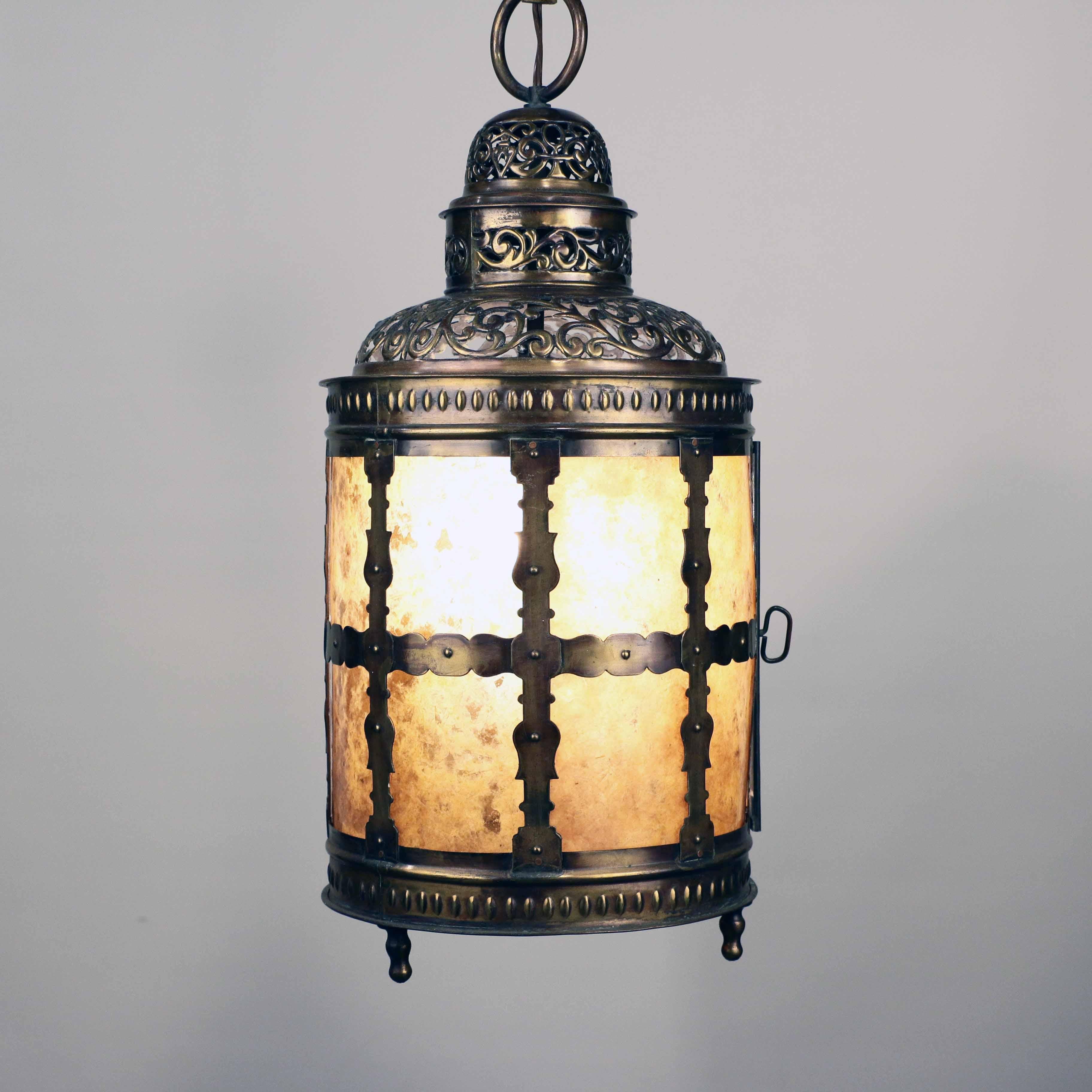 Arts and Crafts cylindrical hand pierced brass lantern with three mica panels and mica bottom; a door opens to the side.