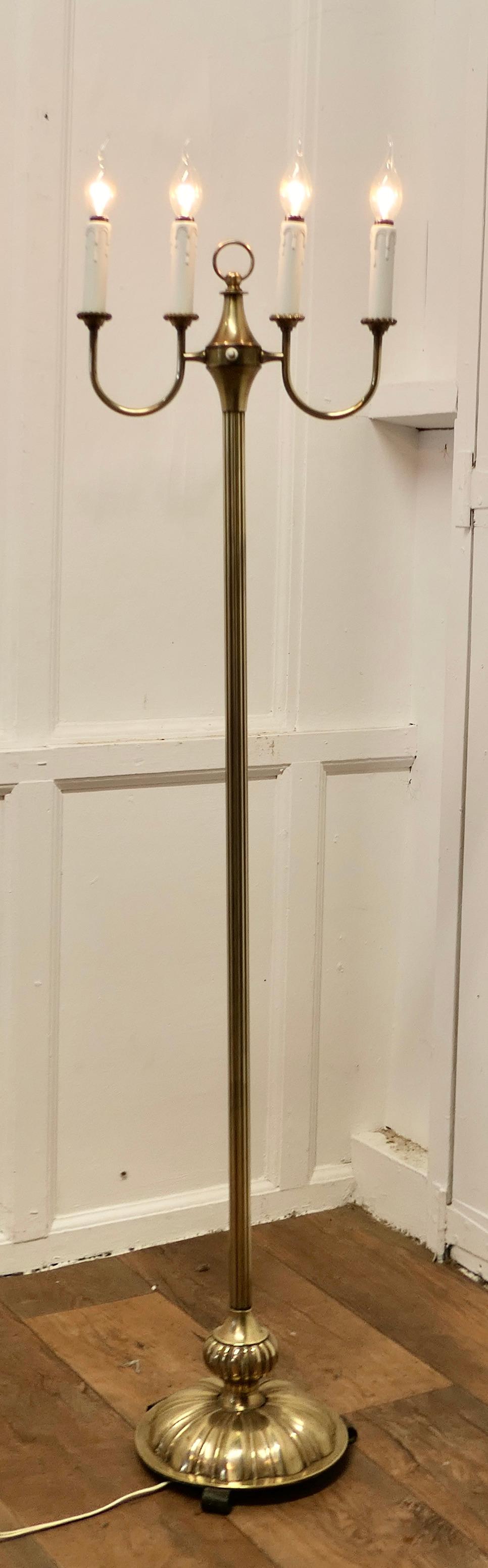 Arts and Crafts Brass Candelabra Floor Lamp, Standard Lamp

This is a simple and attractive design, the lamp has a slender fluted upright set on a round base which supports a 4 branch candelabra

The lamp has relatively new wiring and is in good
