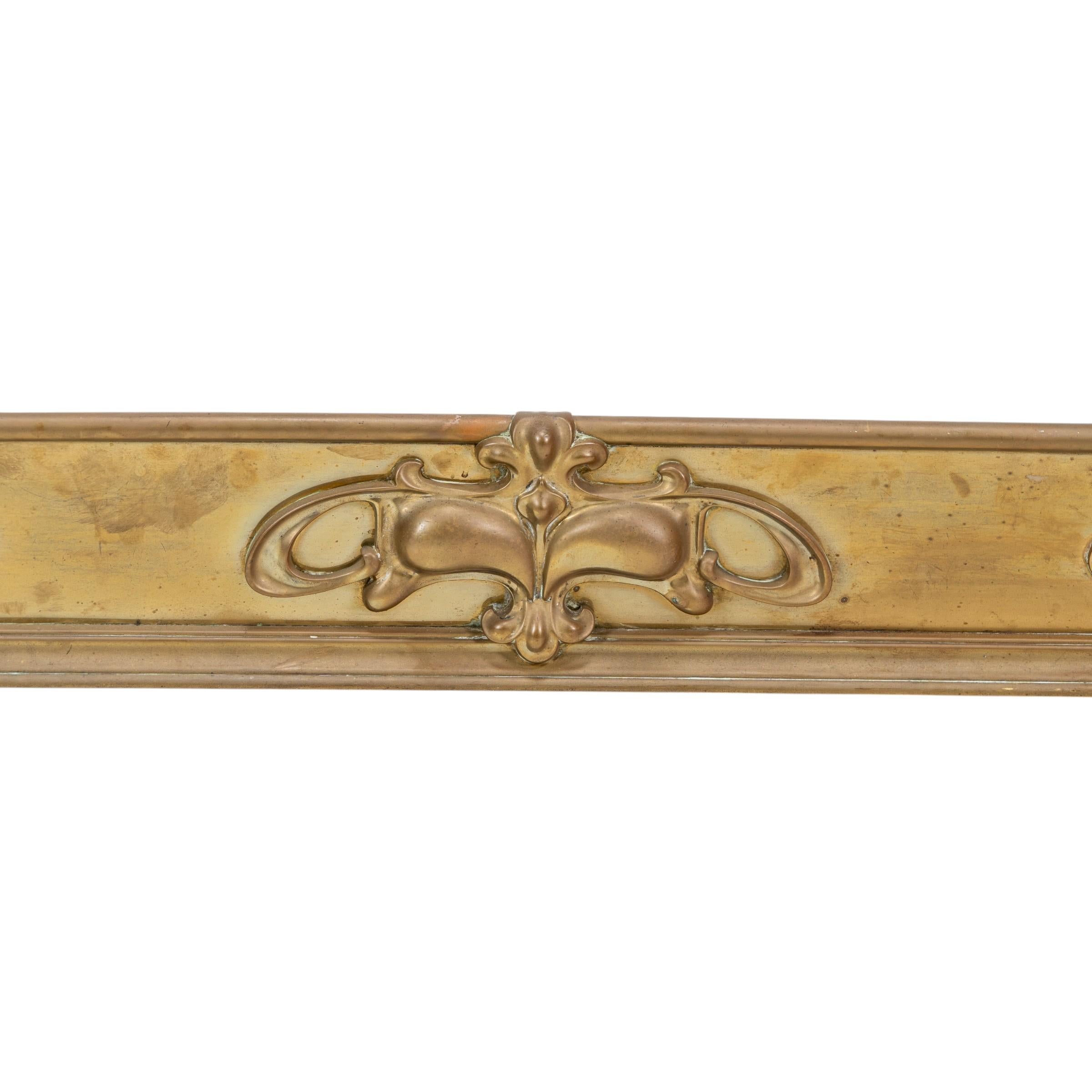 Arts and Crafts brass fender adorned with embossed floral decorations For Sale 5