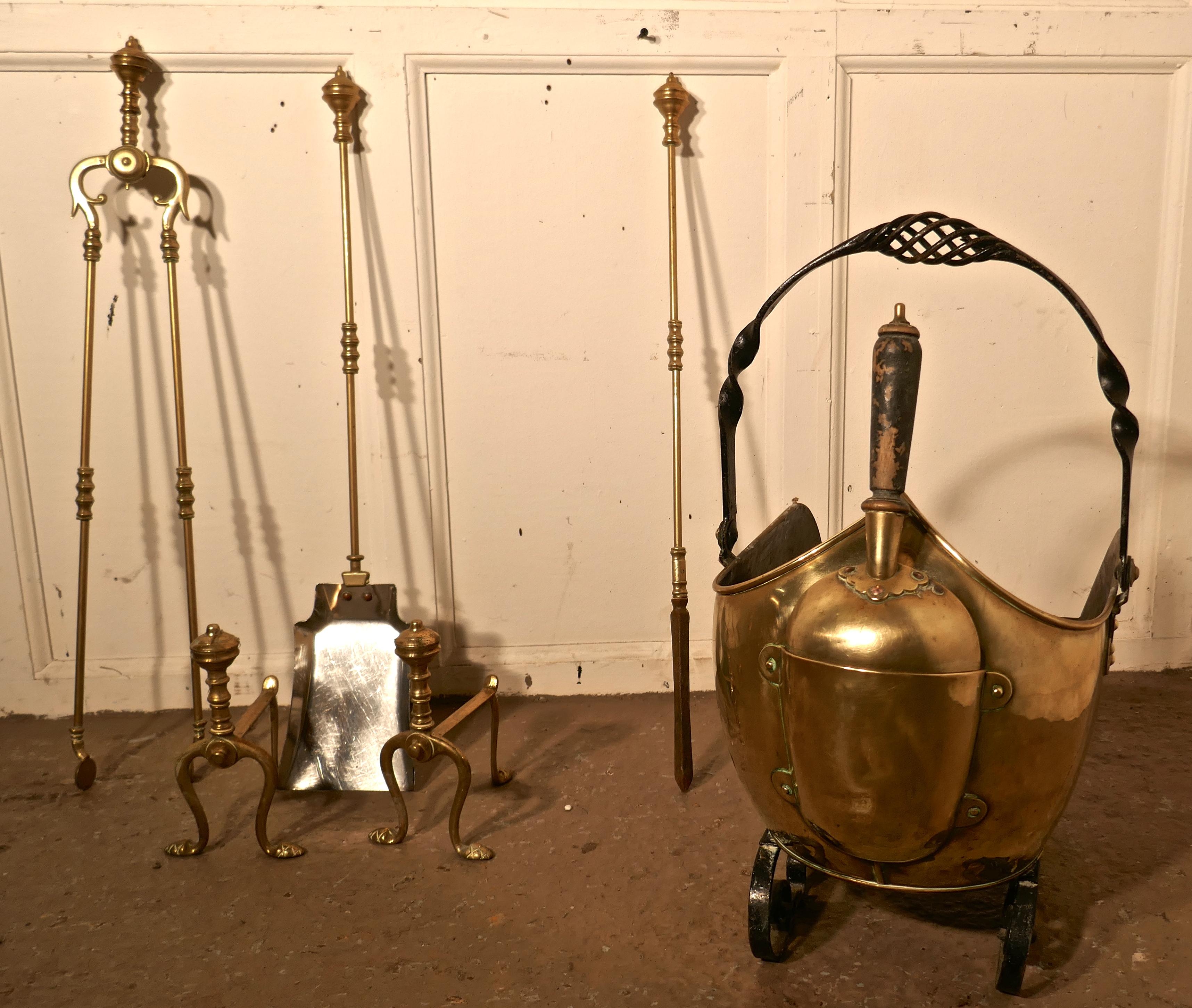 Arts and crafts brass helmet coal scuttle and companion set

This is a long fireside companion set, tongs, shovel and poker complete with andiron rests and a helmet coal scuttle with integral shovel

The Scuttle is a top quality piece with an