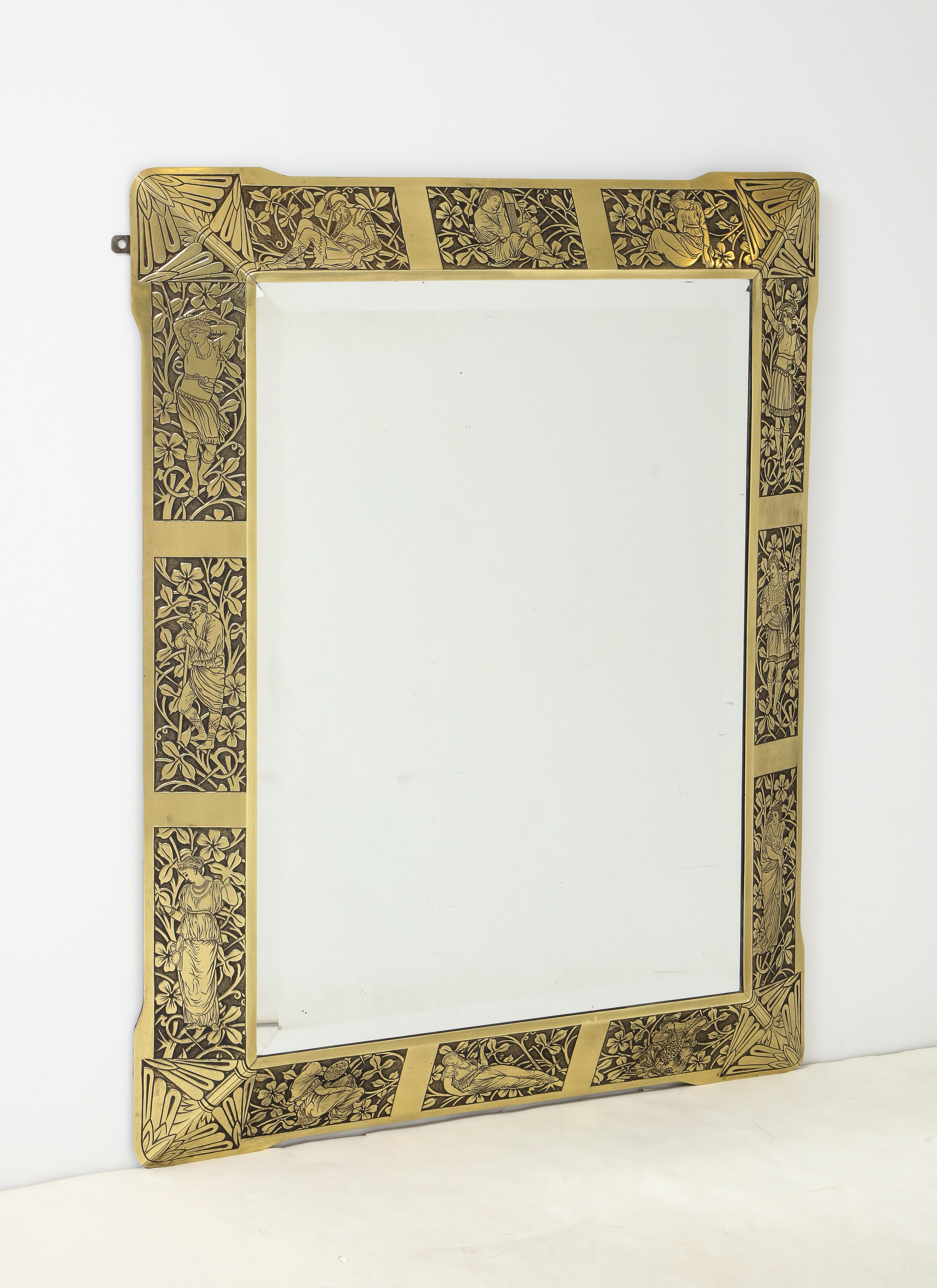 Fine Arts & Crafts etched brass mirror, each panel depicting a Pre-Raphaelite figure within a foliate decorated ground.