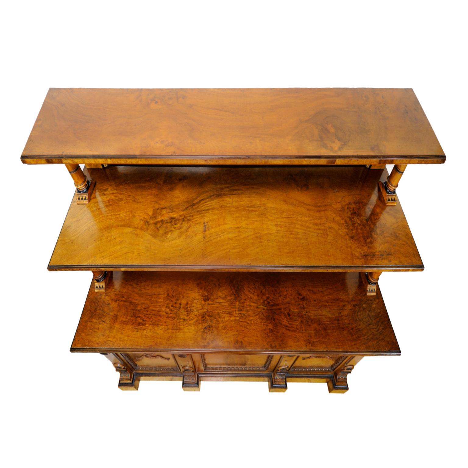 This is an extremely impressive Arts and Crafts burr oak serving table/cabinet with black ebony detailing and complete mirrored back panel.

The interior consists of three separate fully shelved compartments. A top quality cabinet, possibly by