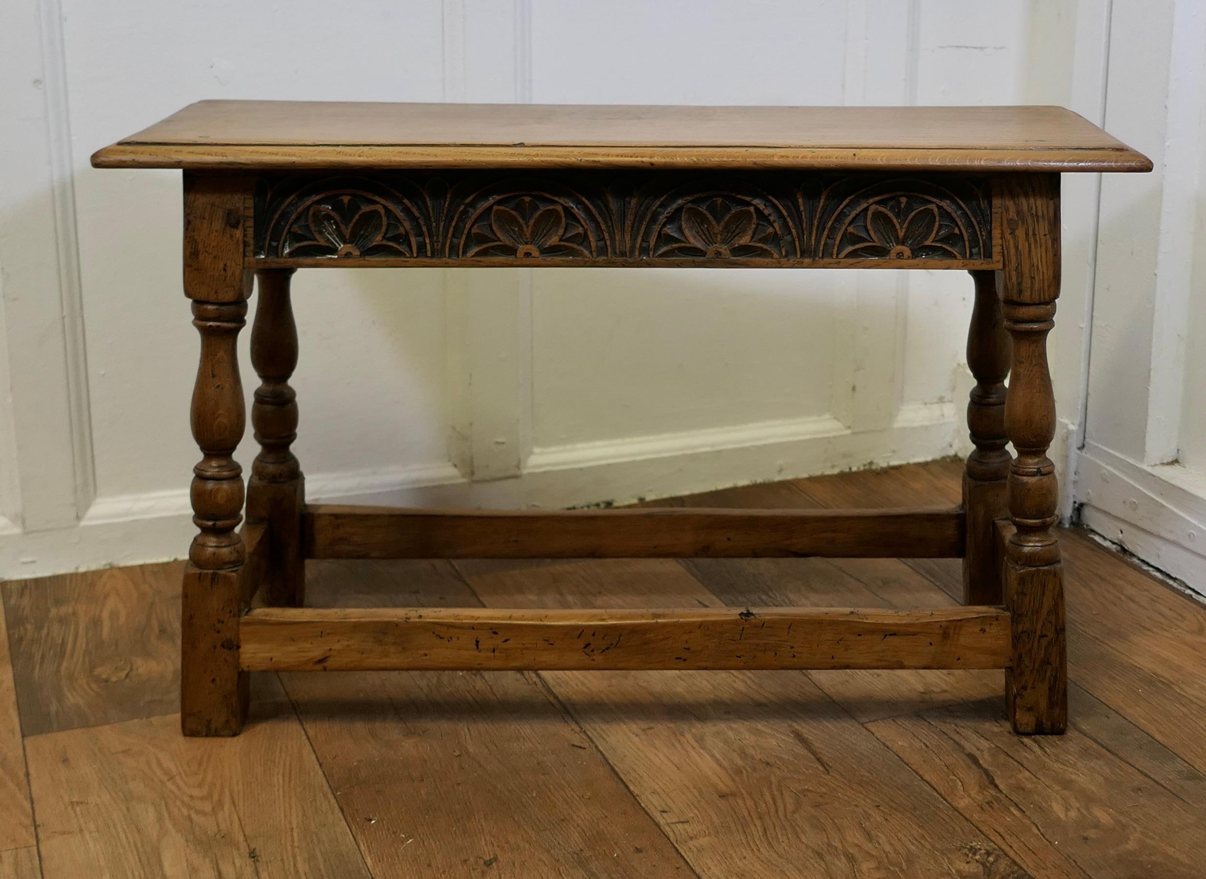 Arts and Crafts Carved Country Golden Oak Joint Style Window Seat, Hall Bench

This a good piece of Victorian Country Furniture, it has a solid Oak seat with a moulded edge and the apron below has decorative carving on all 4 sides, the stool stands