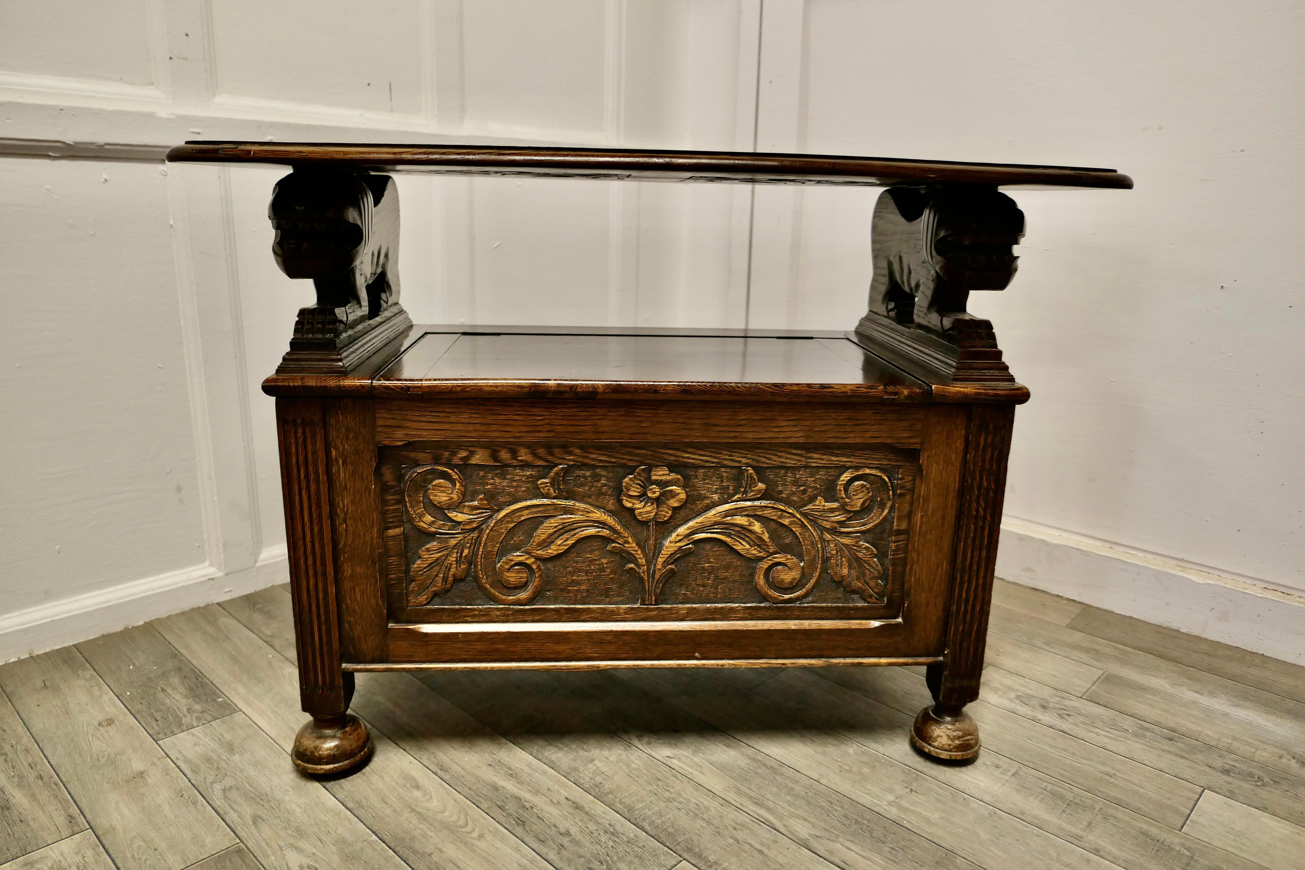 Arts & Crafts carved Oak Monks bench settle, hall table.

This useful piece is known as a Monks Bench, it is in fact a settle with a storage compartment inside the seat and the back of the bench can be pulled over, it then rests on the top of the