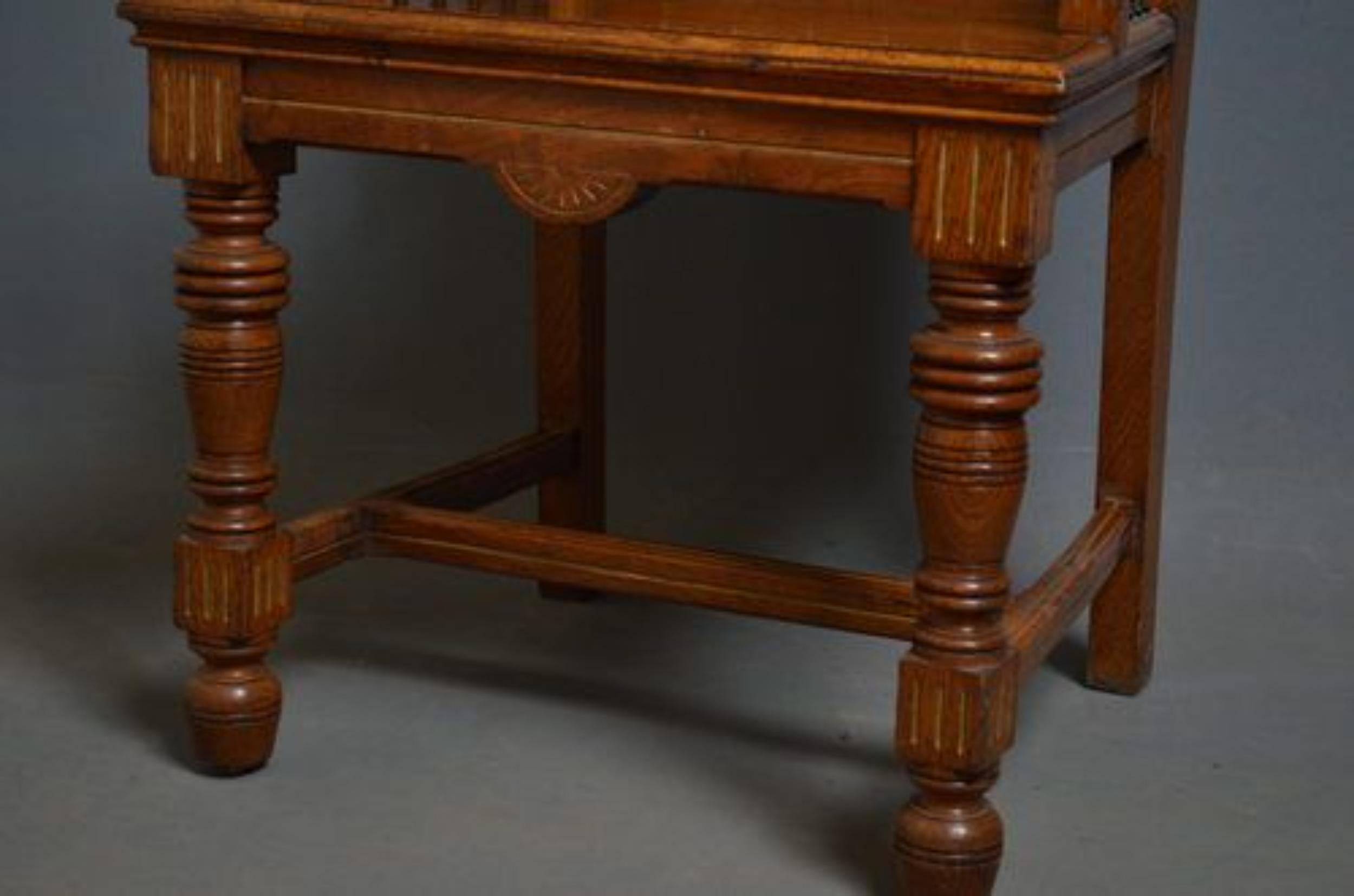 Sn692 A superb example of an Arts & Crafts - Gothic revival hall chair constructed from pollard oak having ebonised finials to the back and sides, well defined carved floral panels, standing on turned legs with stretcher to the base, all with carved