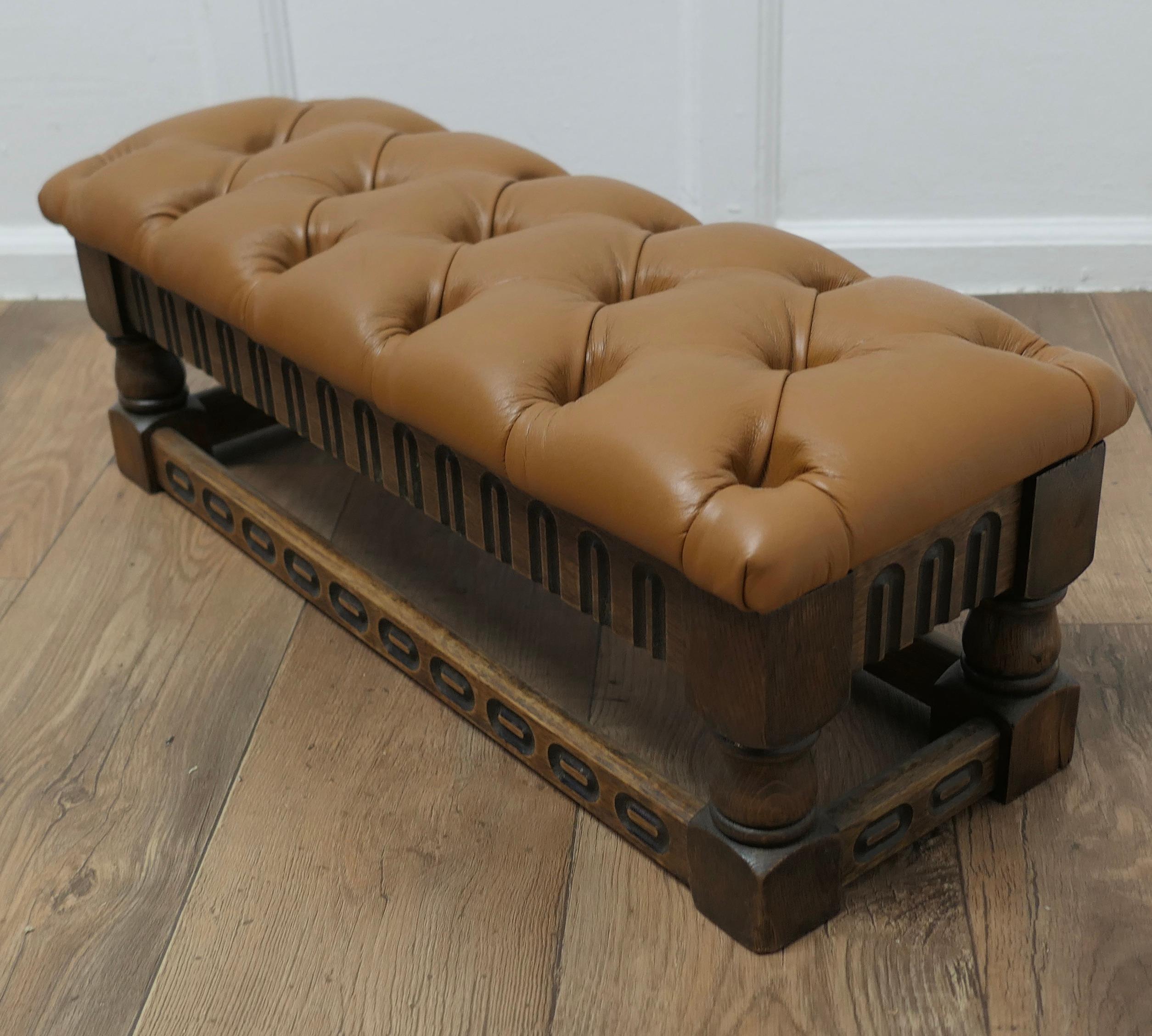 Arts and Crafts Chesterfield Buttoned Leather Oak Foot Stool

A Lovely piece, this Victorian stool is made in Oak, it stands on short Turned legs and has gothic style carving around the apron and along the stretchers, it has been upholstered in soft