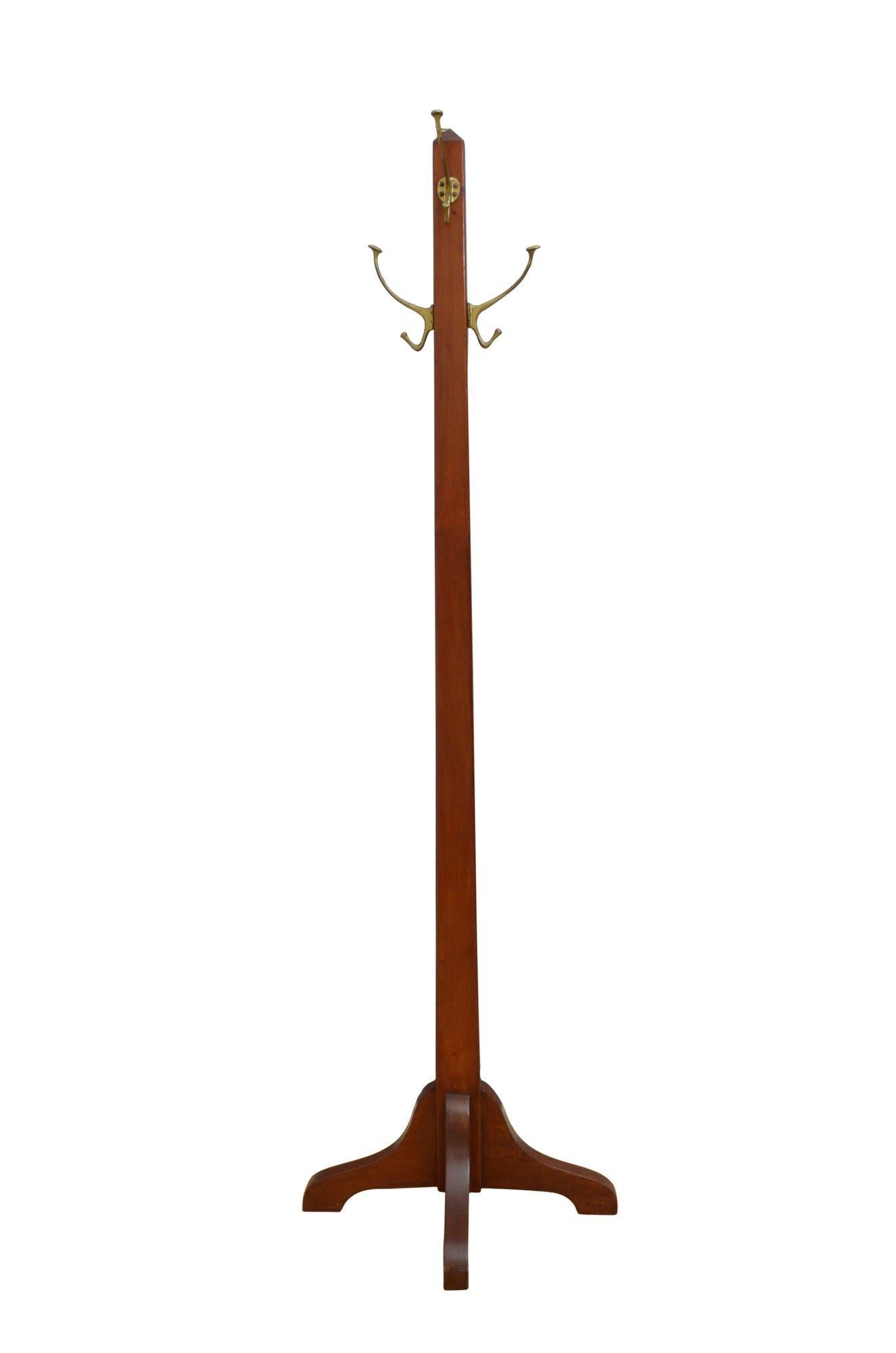 P0281 Arts and Crafts solid mahogany hall stand / hat stand with four original brass double hooks on solid mahogany tapered upright terminating in four shaped and downswept legs. Perfect for small spaces. This antique coat rack retains its original