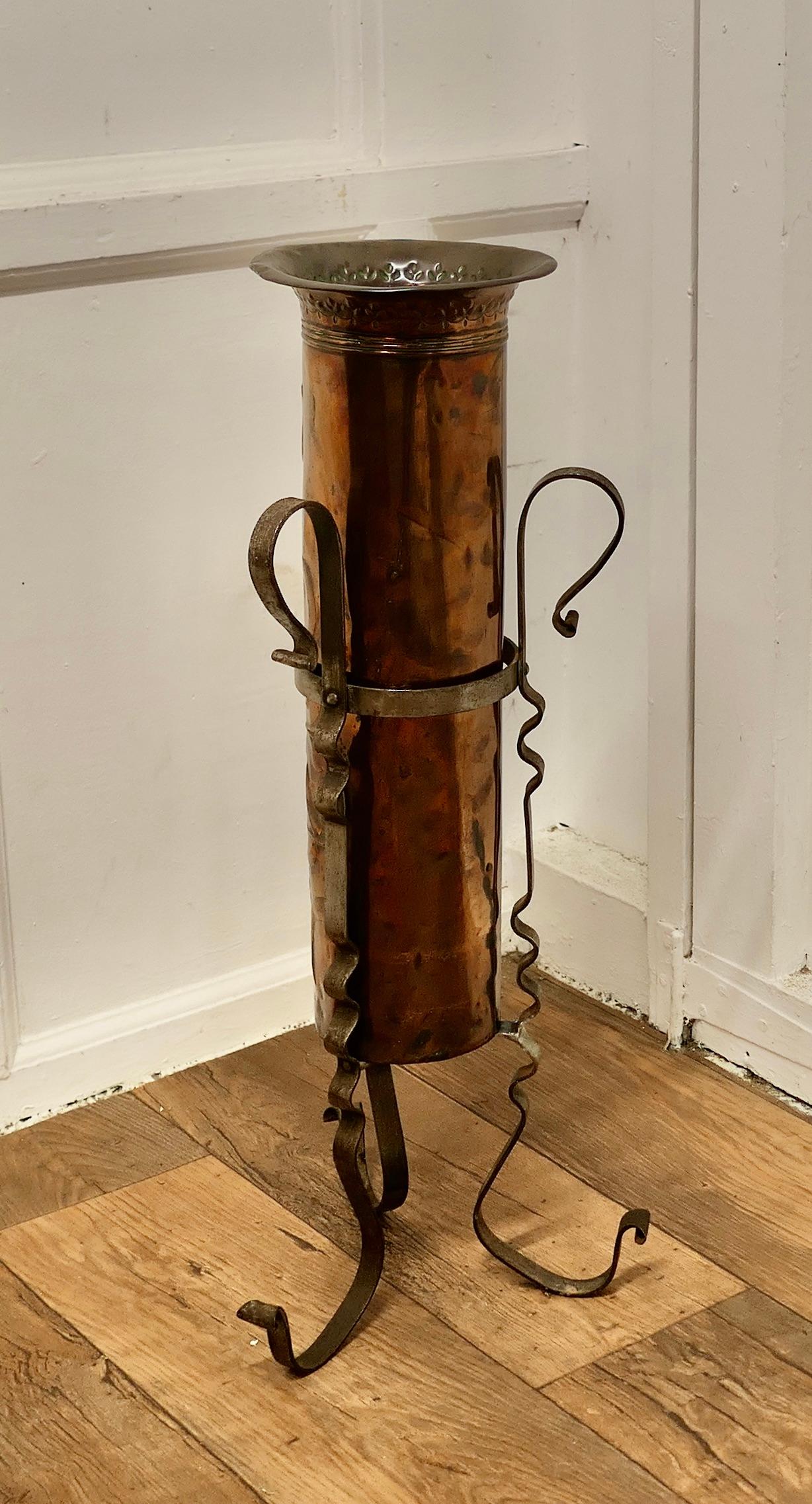 Arts and Crafts Copper and Iron Umbrella Stand

An unusual and attractive piece, the copper receptacle is decorated with Stylised flowers in the Arts and Crafts style and it sits in a very attractive Wrought Iron stand
The stand is 29” tall and 12”