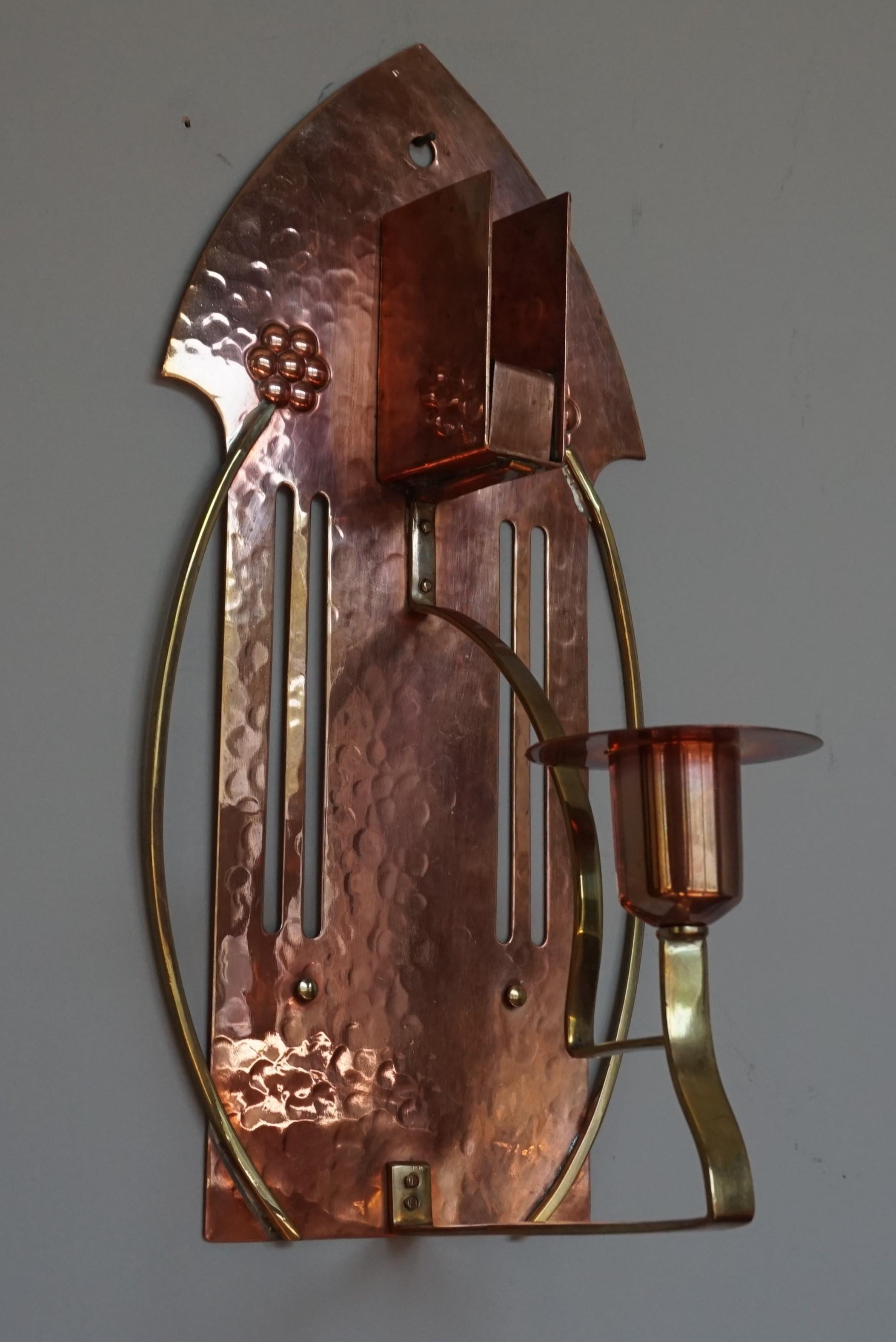 Stunning, rare and aesthetically beautiful candle sconce.

For the collectors of stunning Arts & Crafts antiques in general and those made and marked by WMF of Germany in particular we also have this outstanding wall sconce. All handcrafted out of