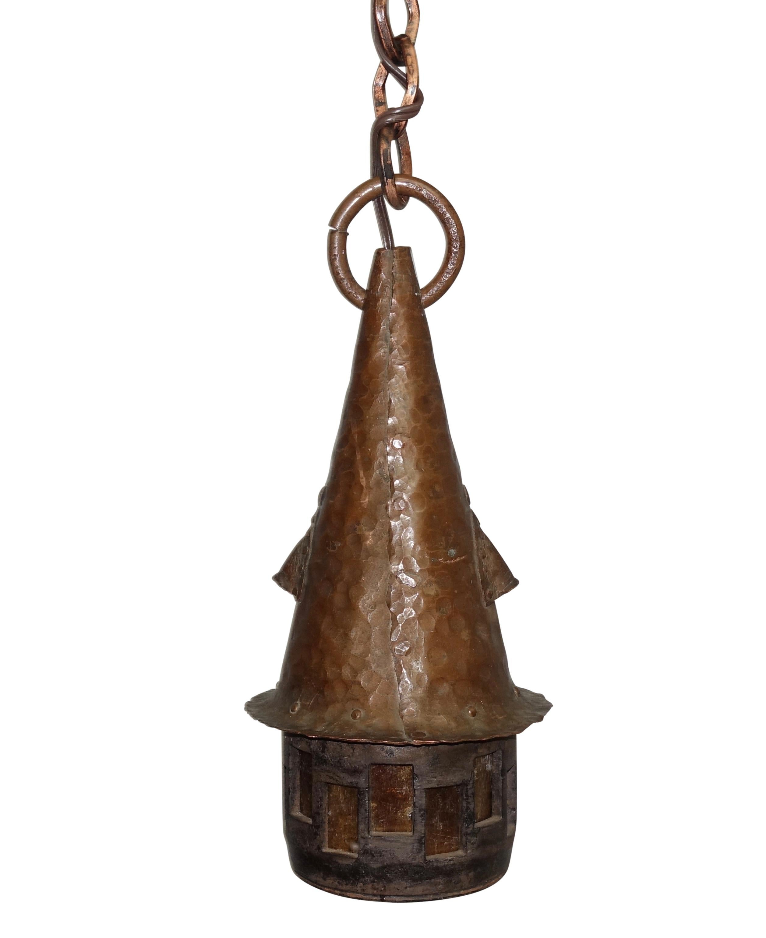 Prairie School style hand-hammered copper lantern with slag glass cutouts, copper chain and canopy. Recently, re-wired, American, circa 1930.
Measurements include canopy and chain.