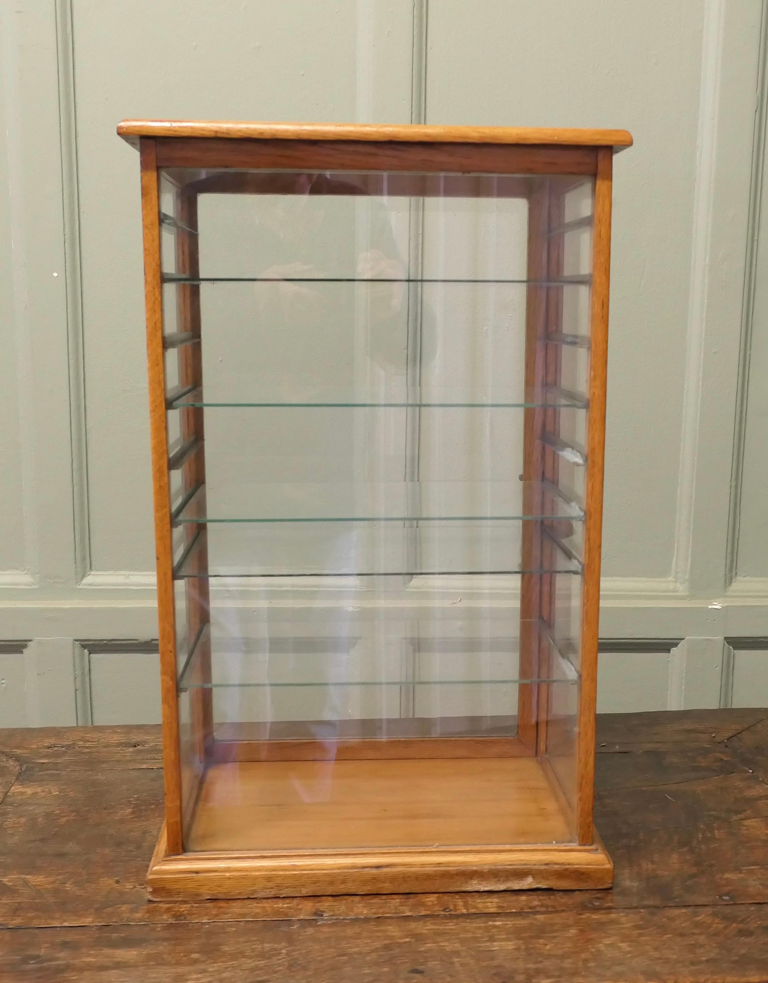 Arts and Crafts Counter Top Shop Display Cabinet, Watches, Jewellery


This is a Golden Oak fully glazed Shop Display Cabinet it has a glass door at the back and 5 adjustable glass shelves to the interior, the door has a working latch at the