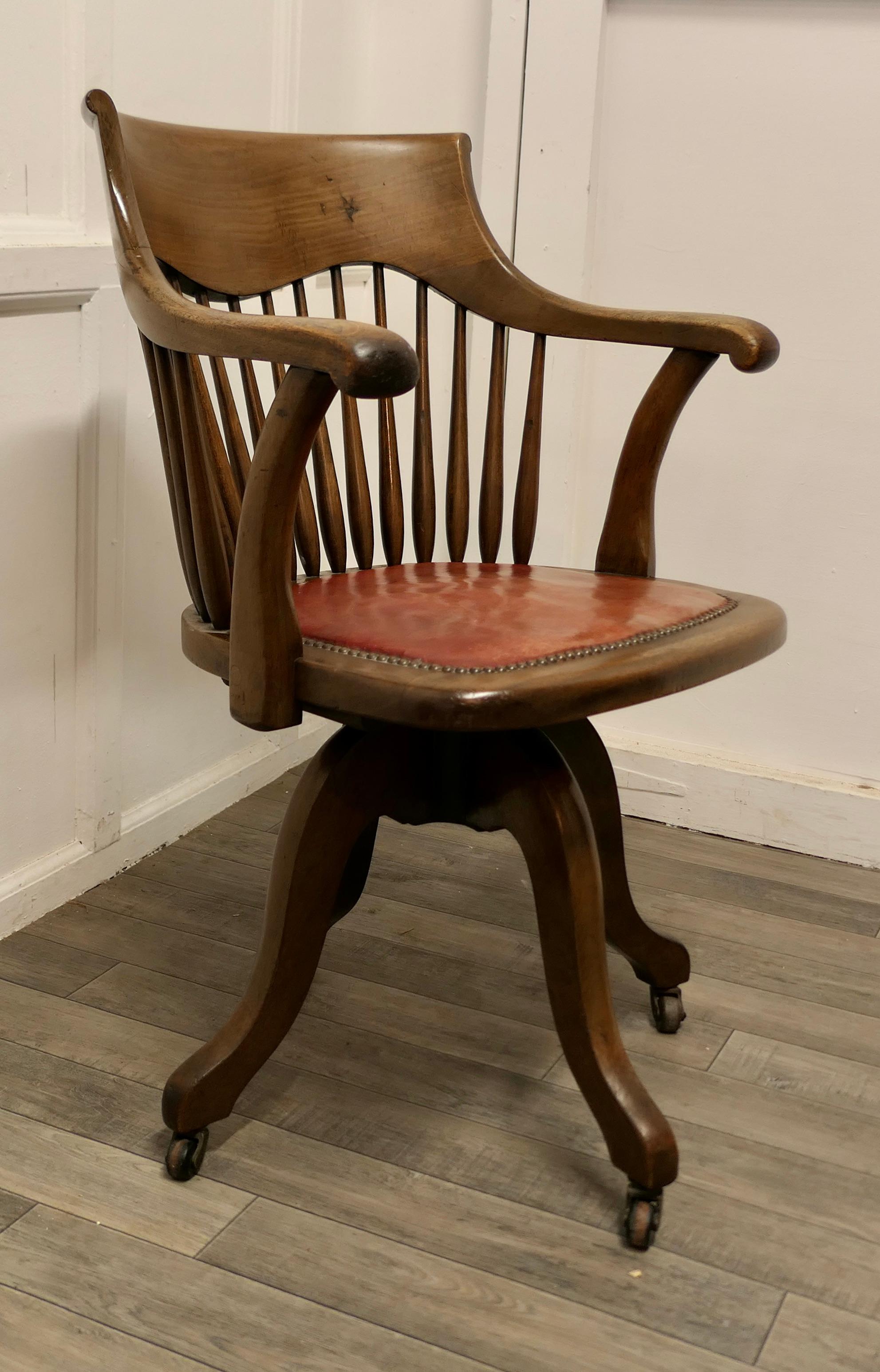 Arts and Crafts Desk or Office Chair by Kendrick & Jefferson

This Art Deco Walnut office chair has an attractive curving shaped back with a wide shaped top rail and comfortable arm rests, the seat is upholstered in red hide (which seems to be