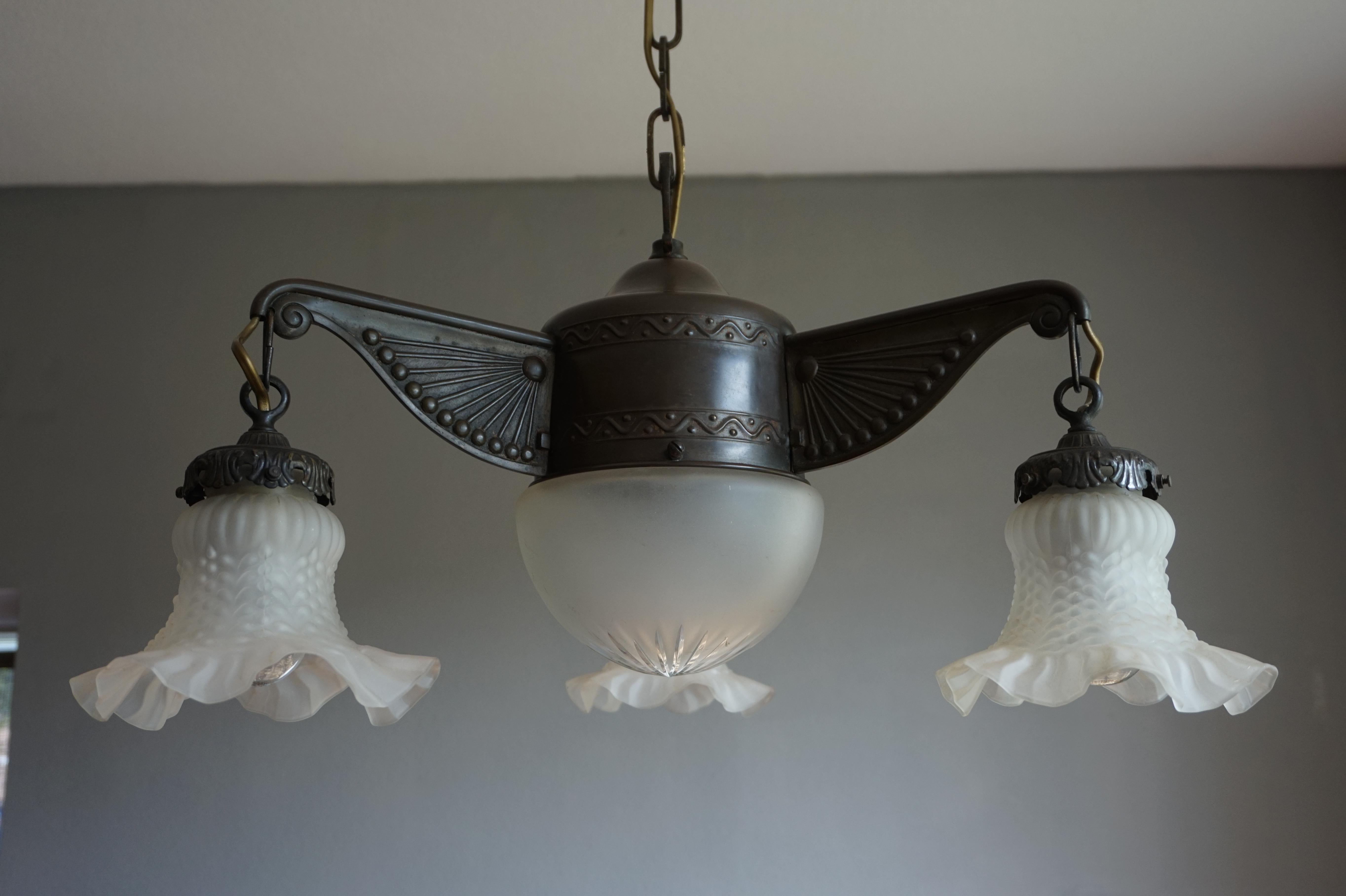 Great looking chandelier for a large entry hall or small dining area.

This small size and beautiful light fixture from the early 1900s is another one of our recent great finds. The design is a real joy to look at and its unusual small size (for a