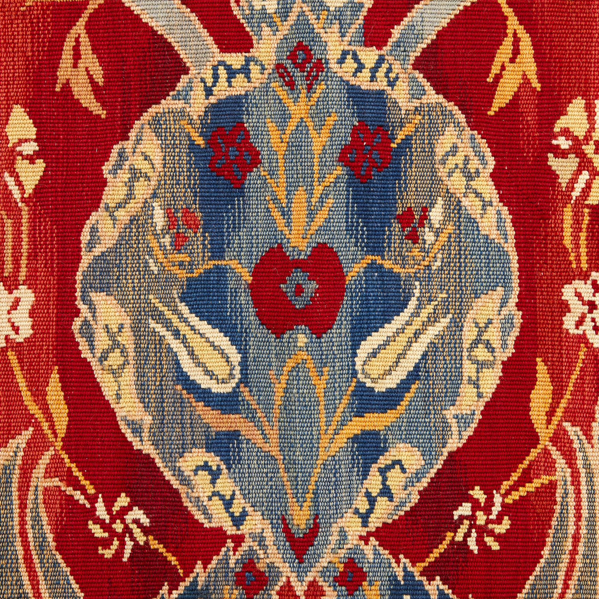 This exquisite textile was created in England in the early 20th century, when the Arts & Crafts style was in fashion in the decorative arts. The movement championed traditional methods of working by hand to create beautiful objects which were then