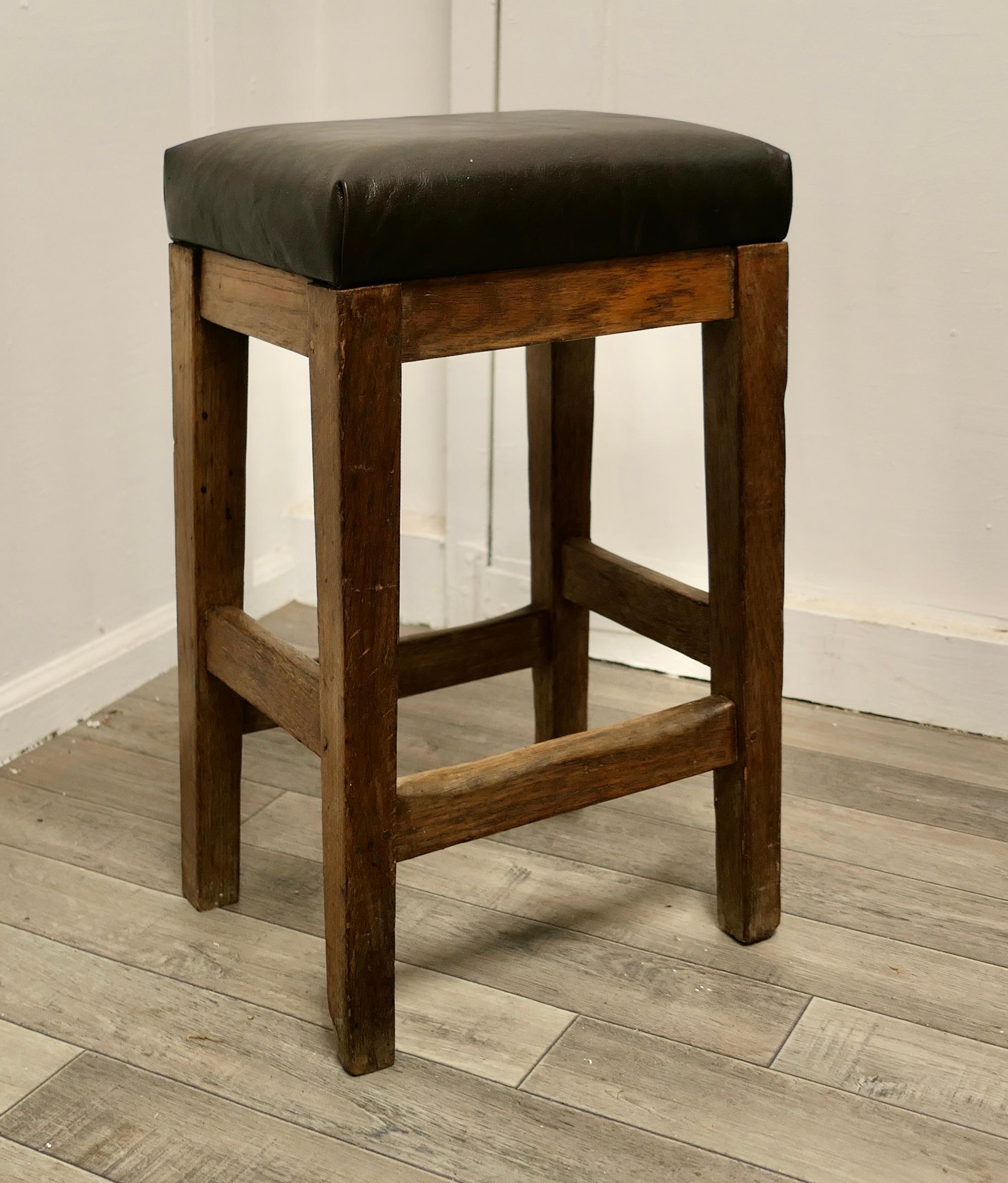 Arts and Crafts Golden Oak and Leather stool

This is a very attractive high stool, it has a square seat and is set on sturdy square stretchered legs, the stool has a soft leather upholstered seat 
The stool is in good sound condition, and has a