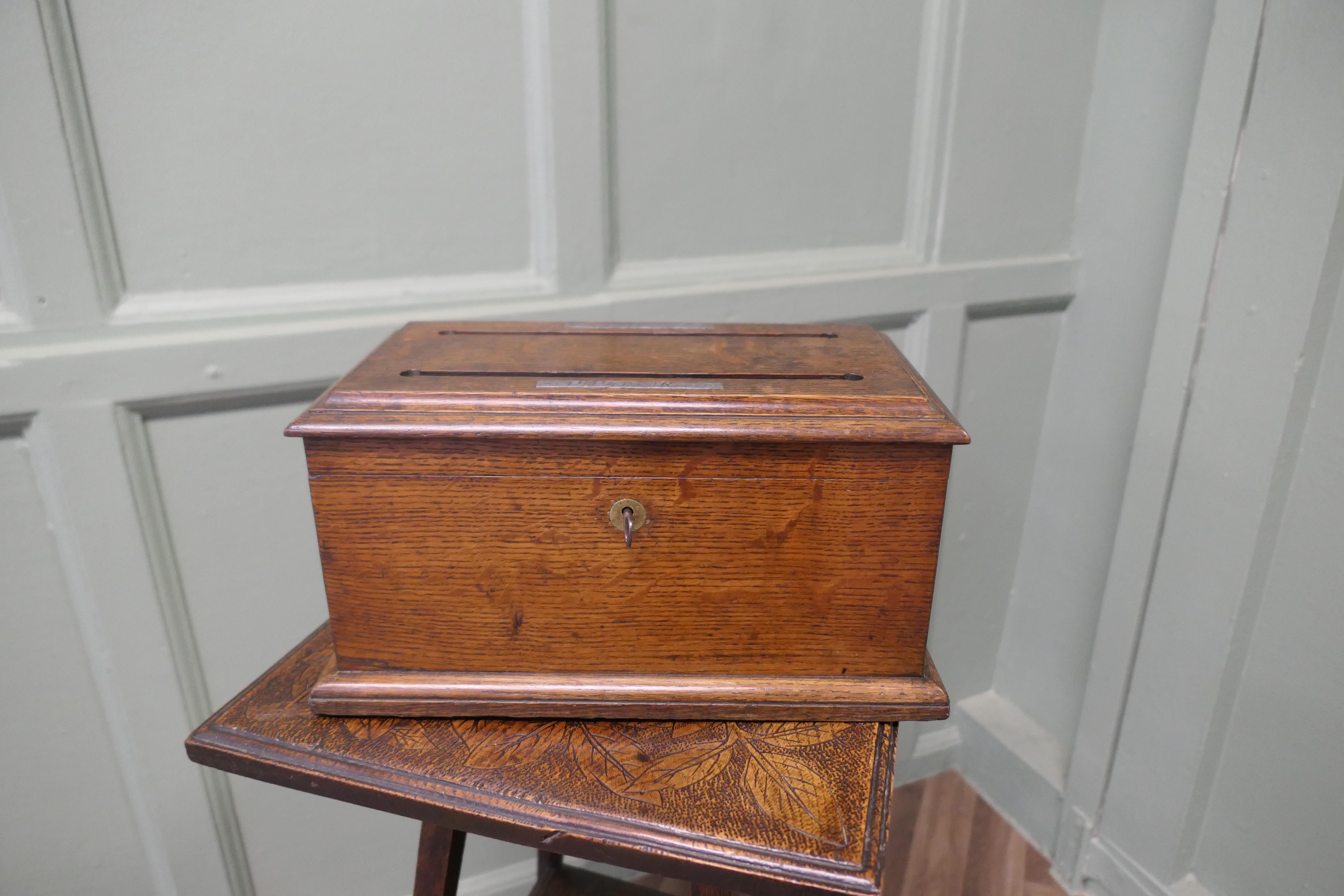Arts and Crafts Golden Oak Correspondence, Post or Letter Box

This very attractive Box is made in Oak, it has 2 letter slots in the top, one for POST IN and the other for POST OUT
The interior has 2 dividers to keep the letters orderly

The Box is