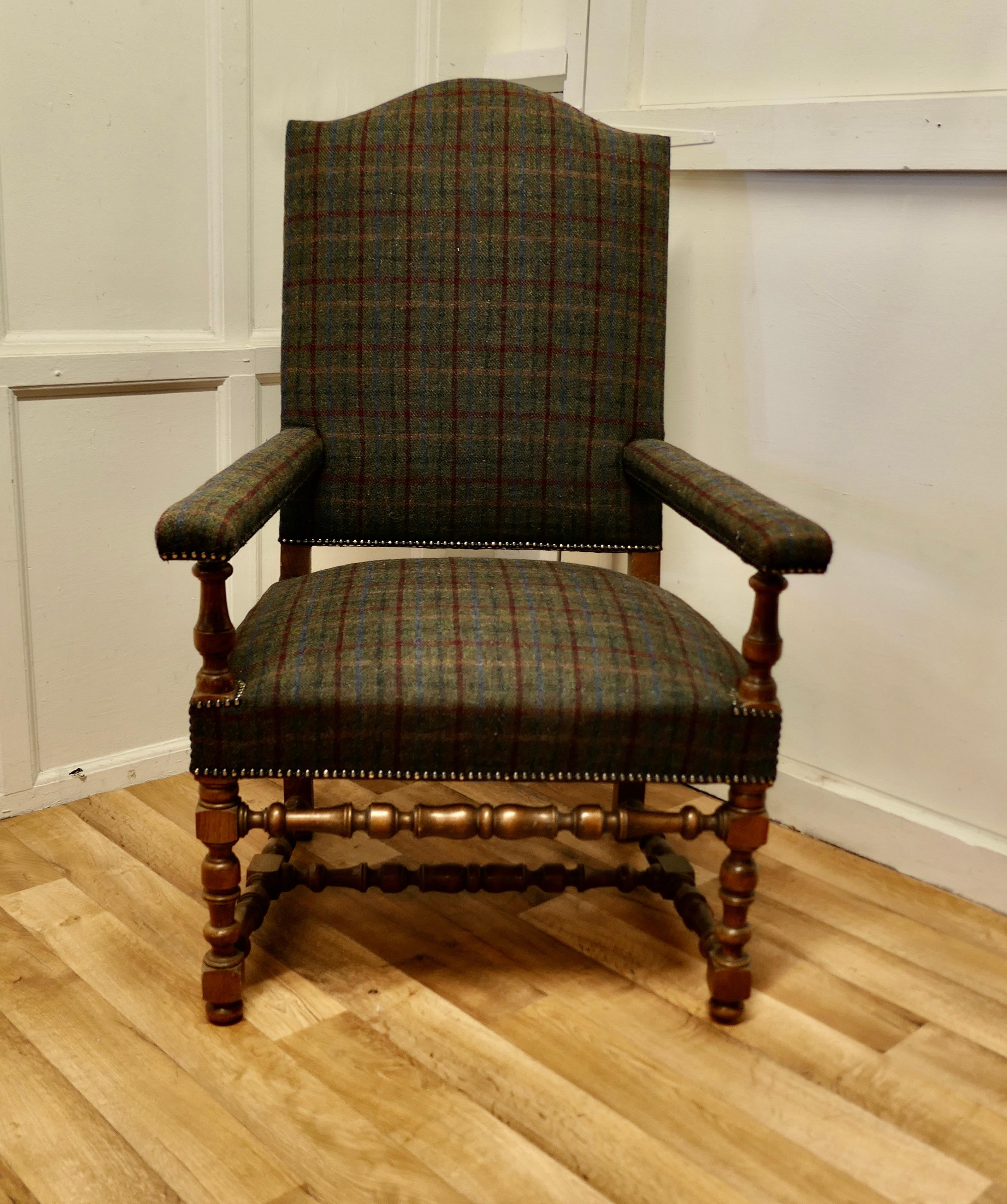 Arts and crafts golden oak library chair, Throne Chair

This is an oversize arm chair it is made in golden Oak and has been upholstered in 100% Harris Tweed check with brass studs
A good large Arts and Crafts chair brought right up to date, very