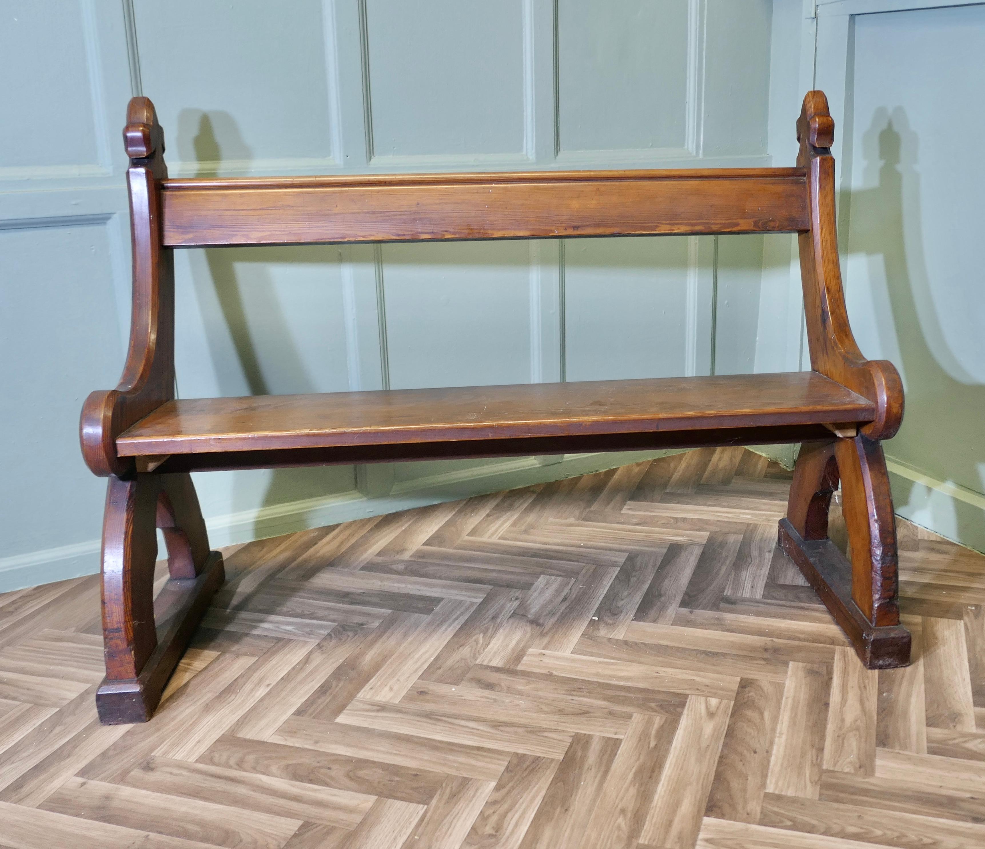 Arts and Crafts Gothic Carved Pitch Pine Pew 
 
The Pew or Settle is made in 2” thick pitch pine, it is heavy and sturdy, it has a carved Tudor rose and a Fleur de lys on both ends, it would make a wonderful Hall Seat or Kitchen Bench

The bench is