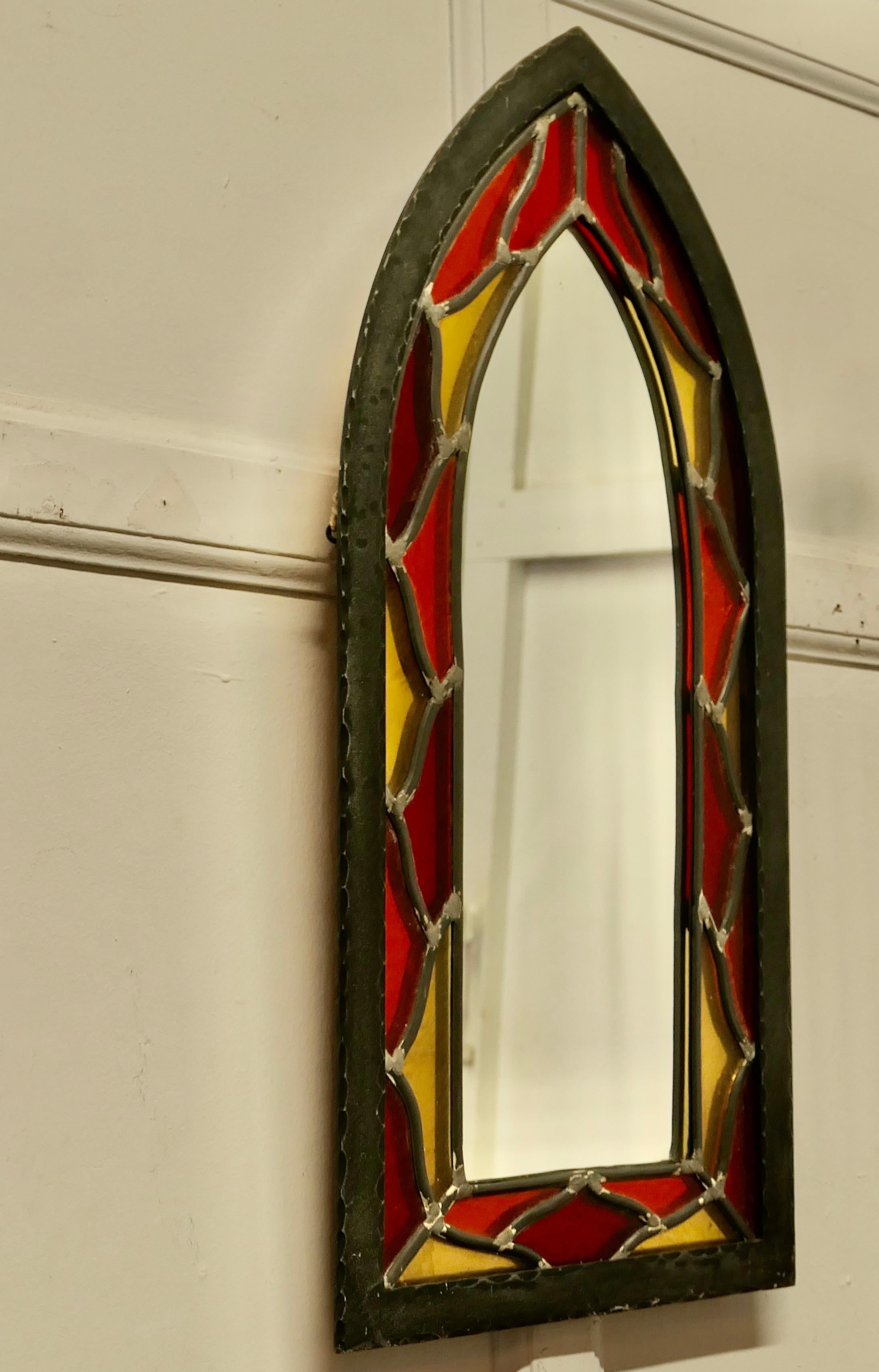 Arts and Crafts Gothic Stained Glass Church Window Mirror

A lovely piece in the Arts and Crafts style, the arched stained leaded glass frame is made in iron in the shape of a church window

A great piece from the 1960s, in good condition, the