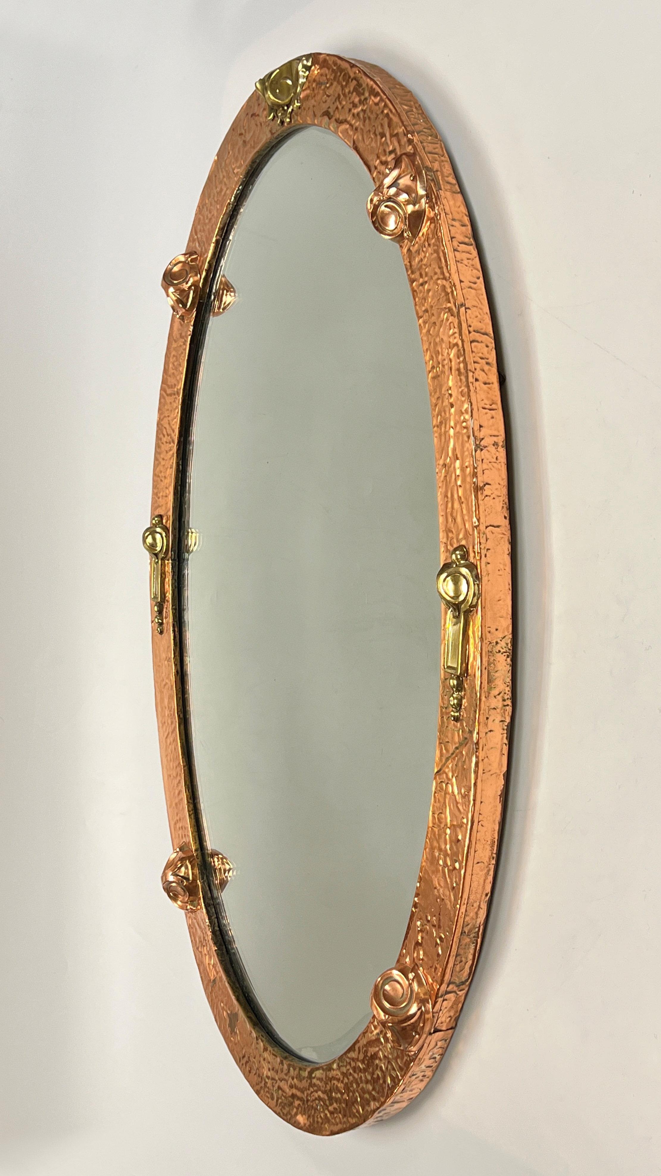 French Arts and Crafts Hand-Hammered Copper and Brass Oval Wall Mirror For Sale