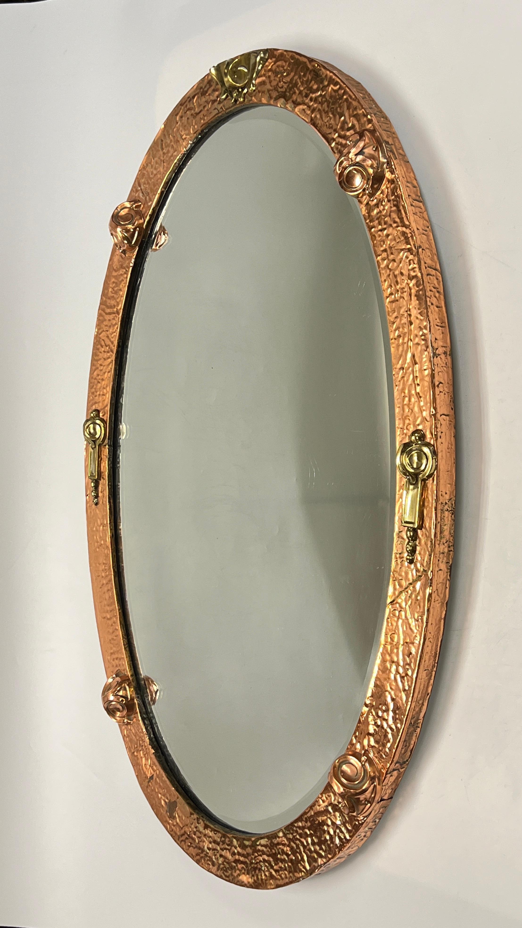 Arts and Crafts Hand-Hammered Copper and Brass Oval Wall Mirror In Good Condition For Sale In New York, NY