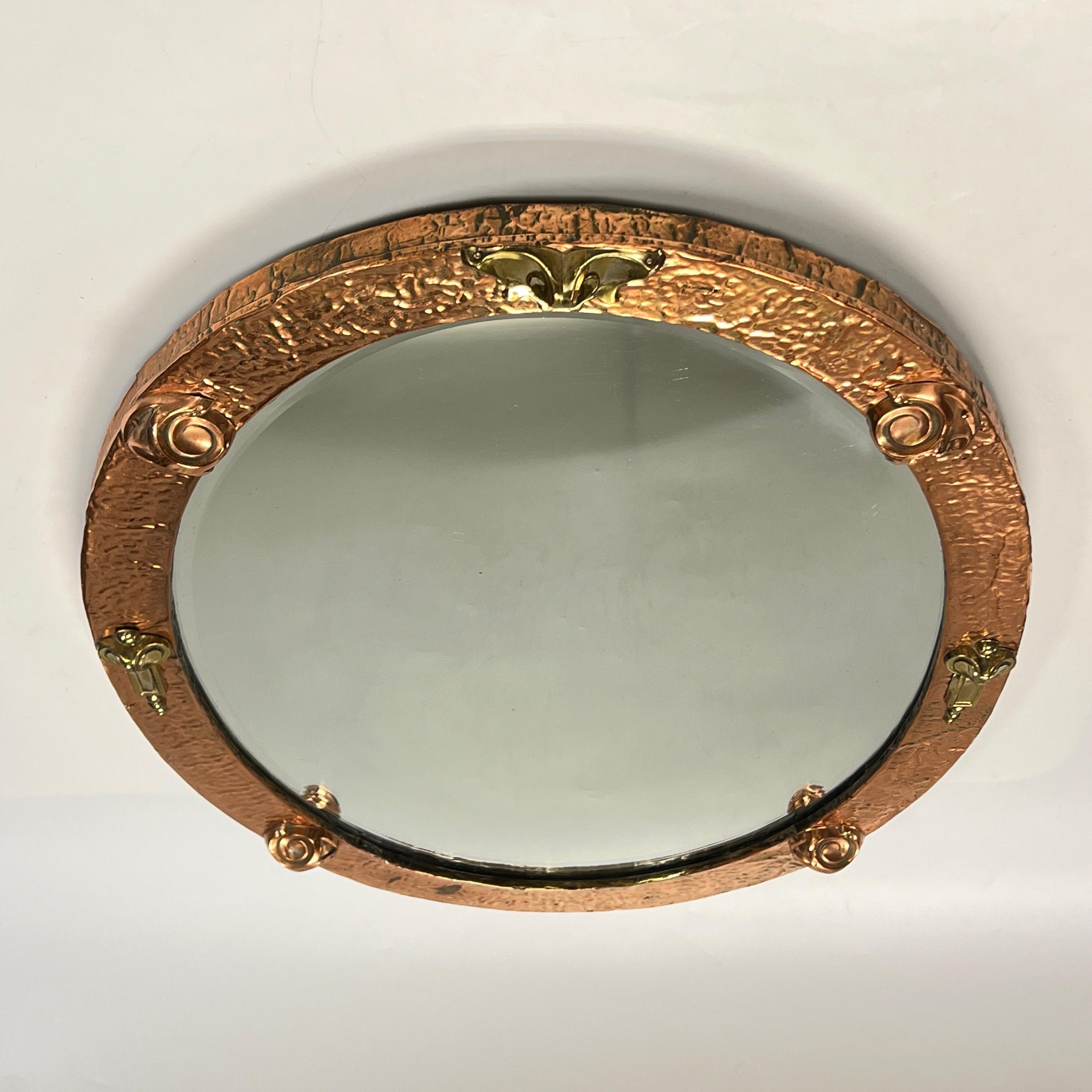 20th Century Arts and Crafts Hand-Hammered Copper and Brass Oval Wall Mirror For Sale