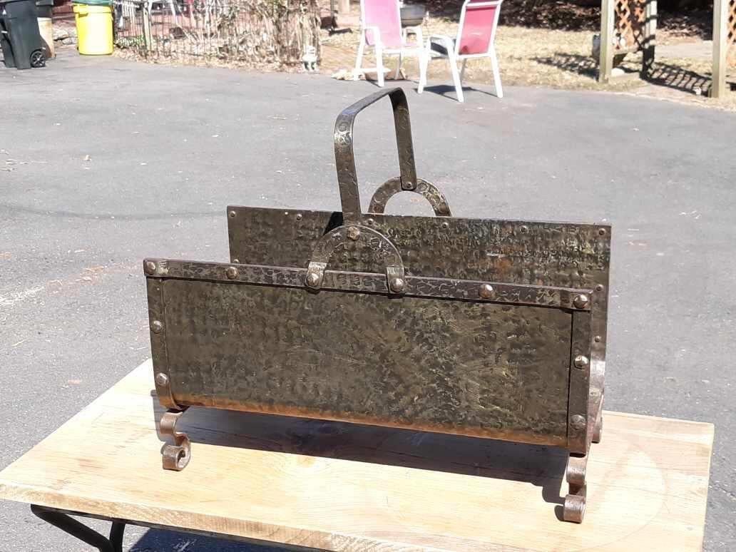 A blacksmith made hand hammered wrought iron log holder. USA Circa 1915. 26 wide, 13.5 deep, 14 high, 22.5 high including handle.