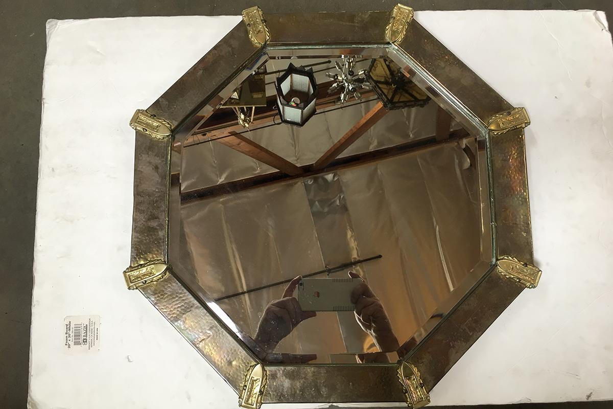 Arts & Crafts hand-hammered octagon copper mirror with brass accents.