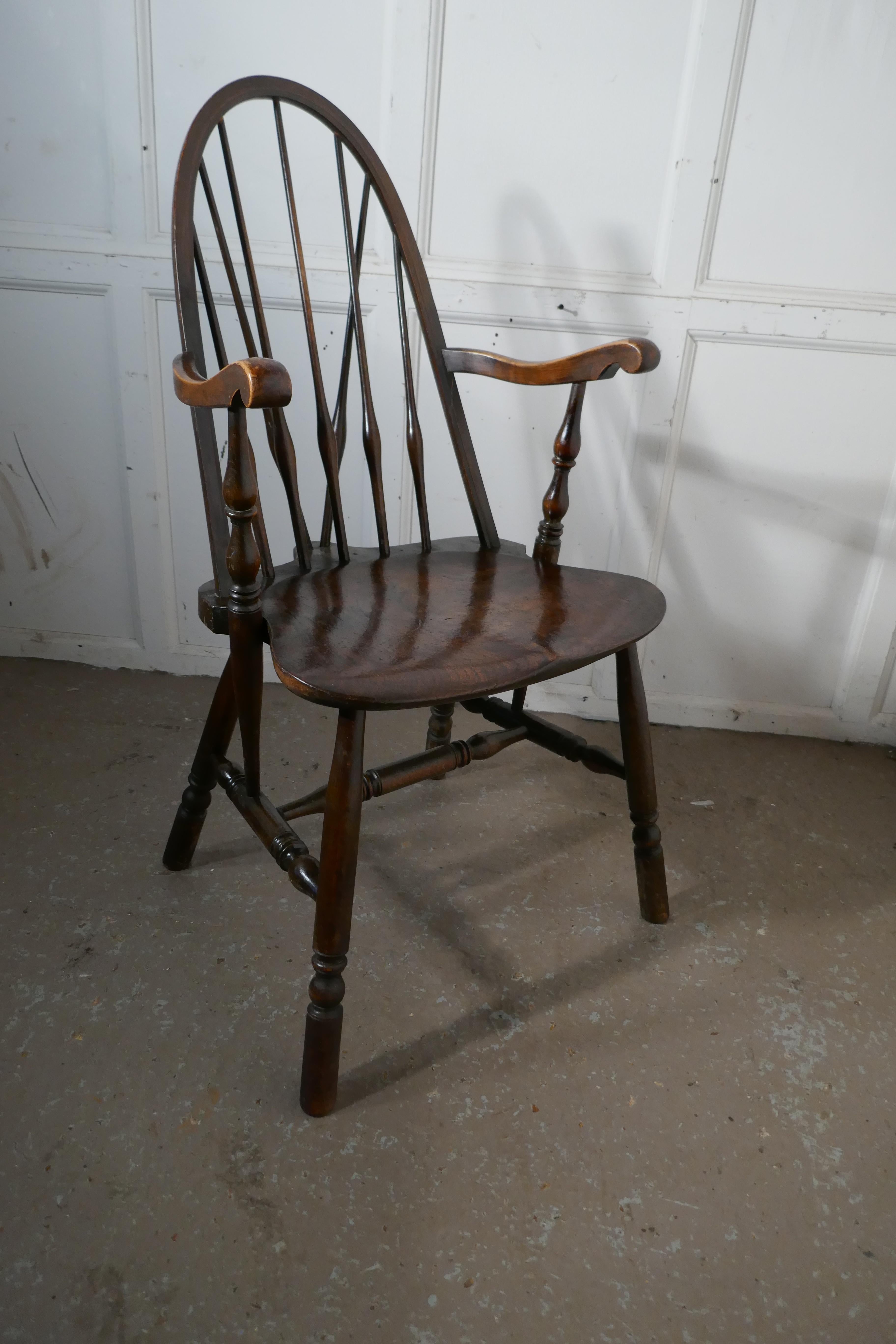 Arts & Crafts high back English Windsor carver chair, 

A superior Arts & Crafts Windsor carver chair
The chair has a superb saddle shaped solid elm seat with wedge back which adds strength to the design 
The chair has turned stretchered legs