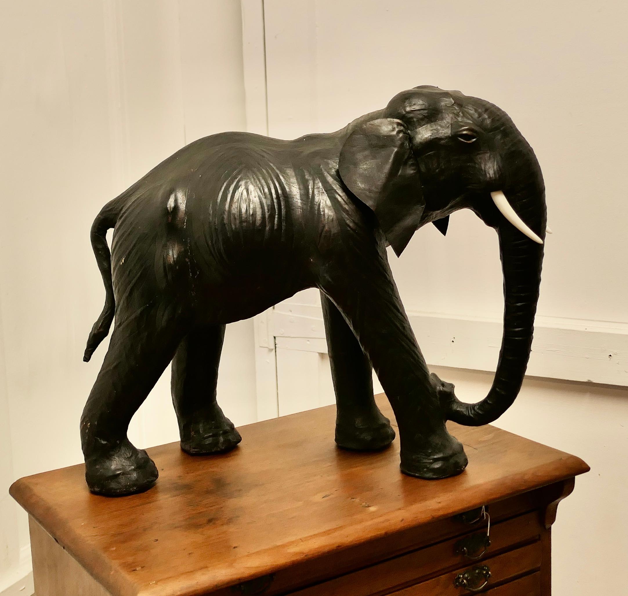 Arts and Crafts Leather Model of a Bull Elephant 

This is a beautiful find from the early part of the 20th Century, it was made for Liberty and is known as “ The Bull Elephant ”
This handsome beast is free standing, he is made in Leather, the tusks