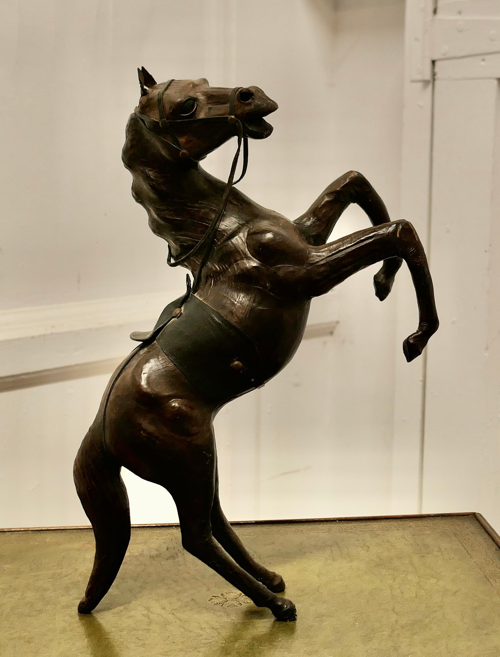 Arts and Crafts Leather Model of a Horse

This is a rare and beautiful find, it was probably made for Liberty but the label is no longer attached 
This handsome beast is free standing in a rearing position
The condition is entirely original and
