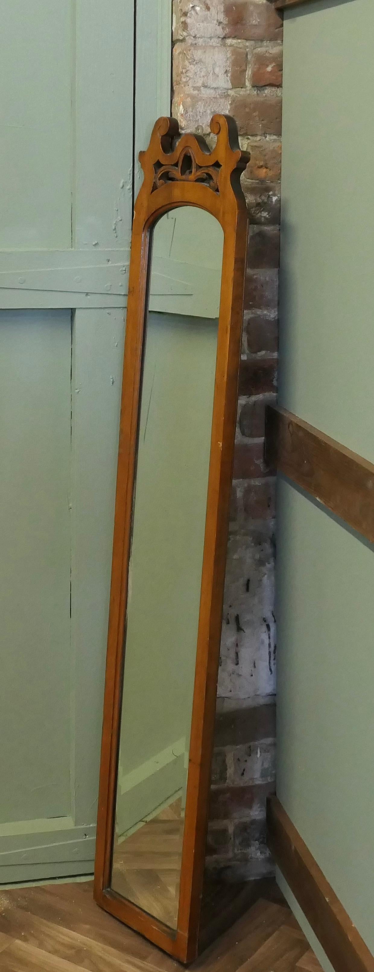 Arts and Crafts Long Narrow Walnut Dressing Mirror

A delightful piece, the mirror has a satin walnut moulded frame with a decorative top cornice, the looking glass is bevelled and in good condition
A good useful and decorative piece
The frame is