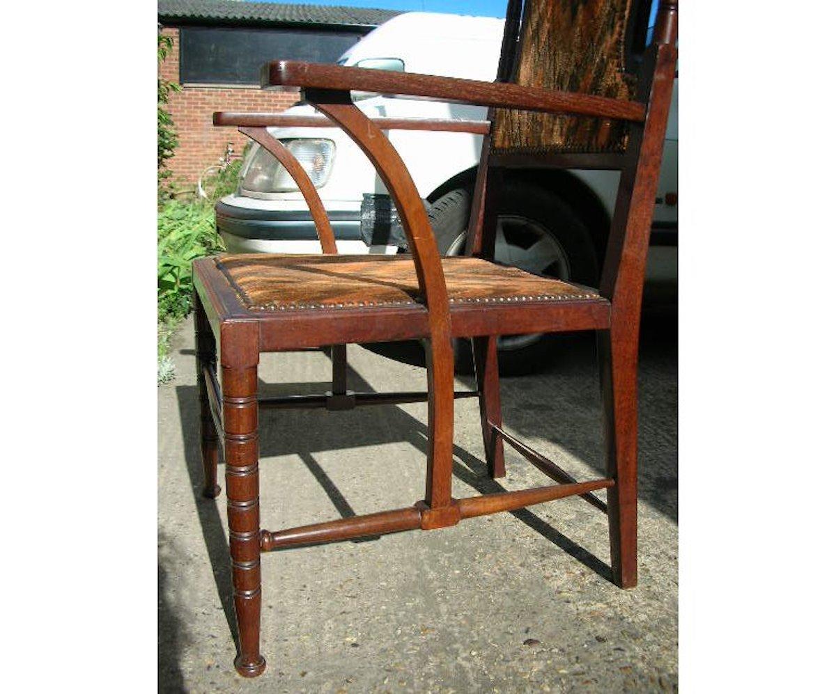 Liberty and Co Attributed. A late Aesthetic Movement Walnut Armchair. For Sale 8