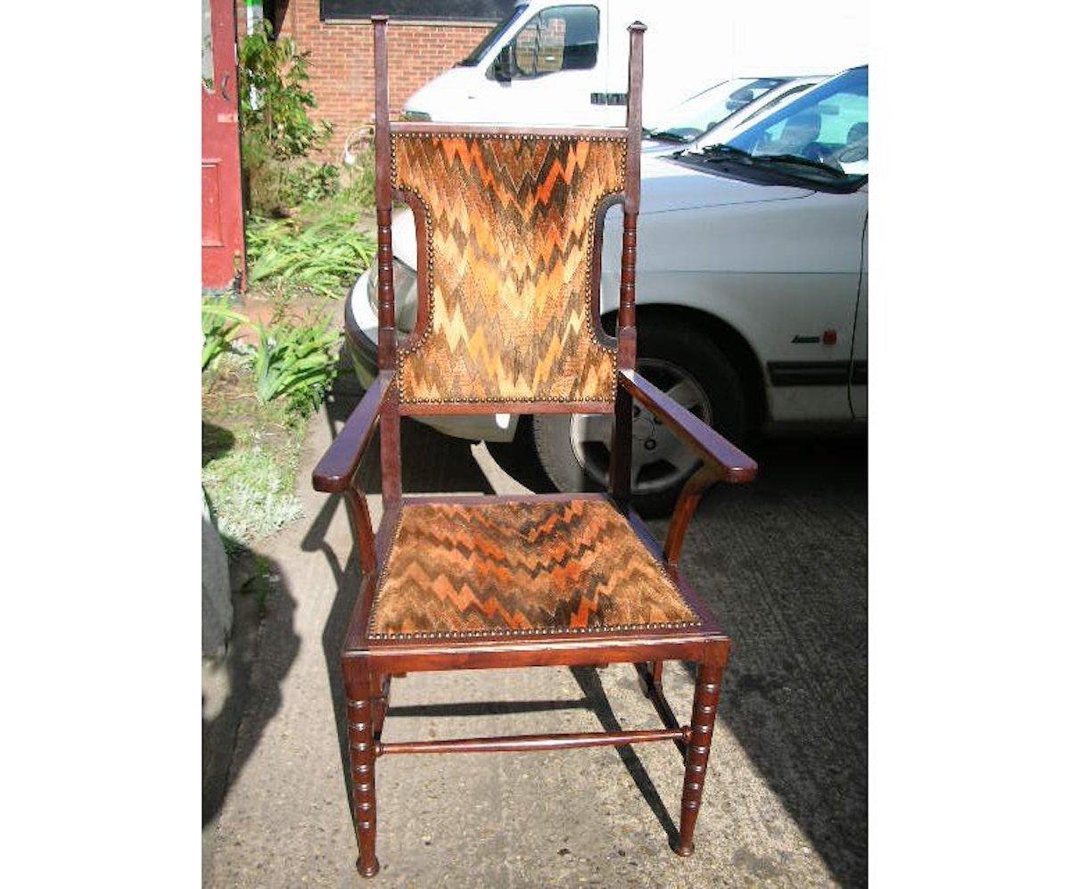 19th Century Liberty and Co Attributed. A late Aesthetic Movement Walnut Armchair. For Sale