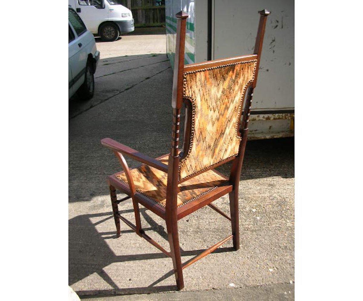 Liberty and Co Attributed. A late Aesthetic Movement Walnut Armchair. For Sale 2