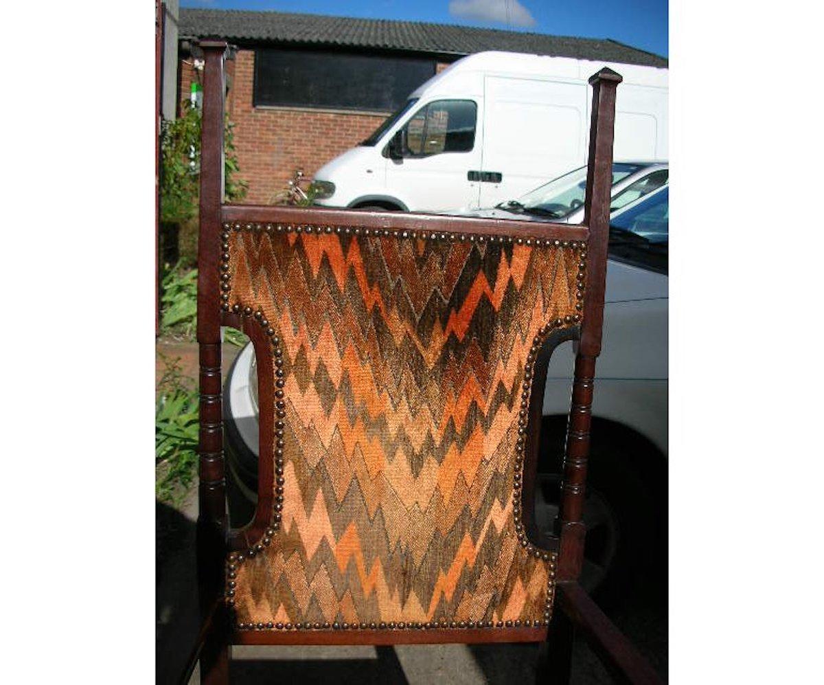 Liberty and Co Attributed. A late Aesthetic Movement Walnut Armchair. For Sale 3