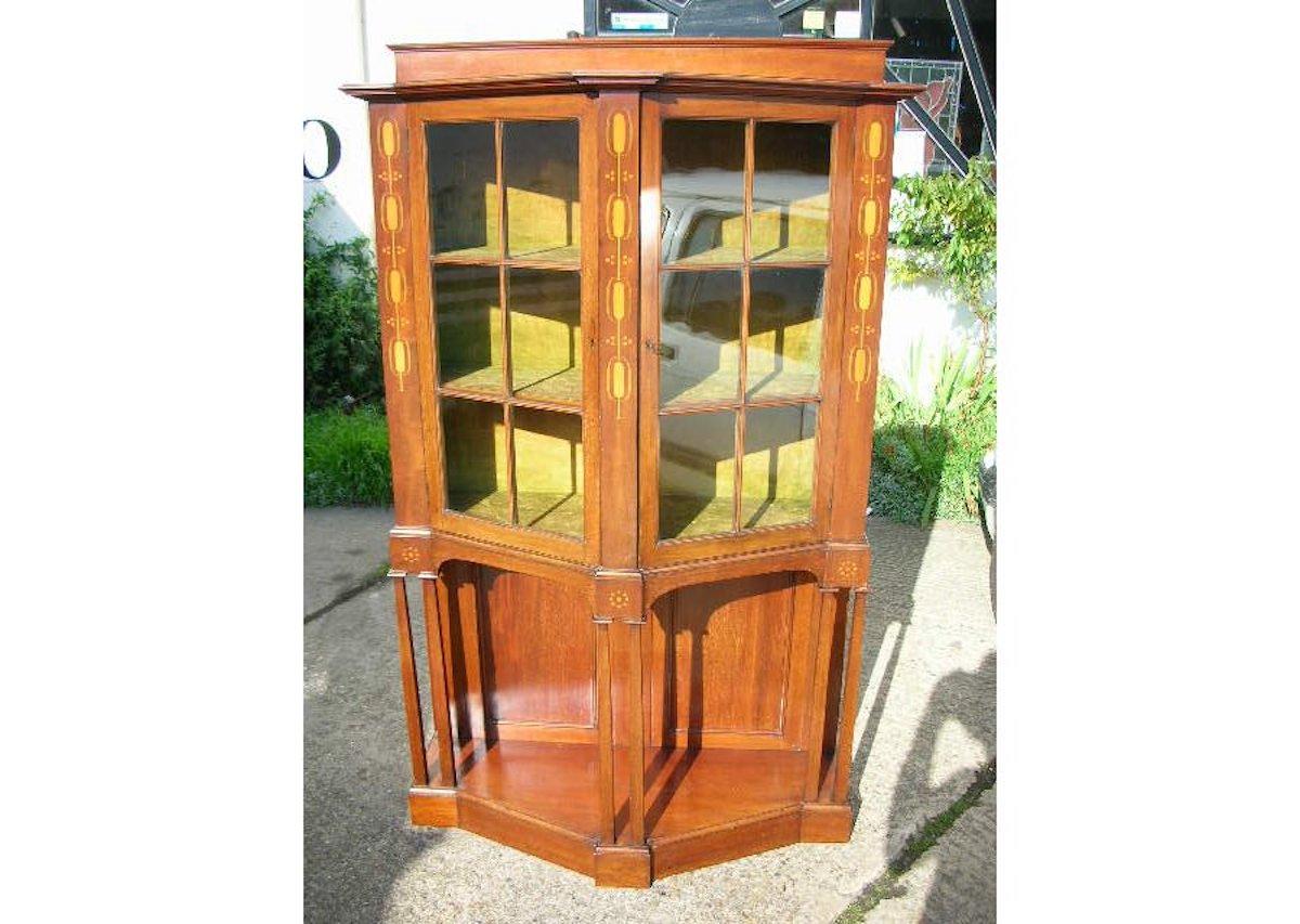 George Montague Ellwood (1875-1955) for J.S. Henry (attributed,) a mahogany and inlaid glazed display cabinet, stamped '301' over '4'.