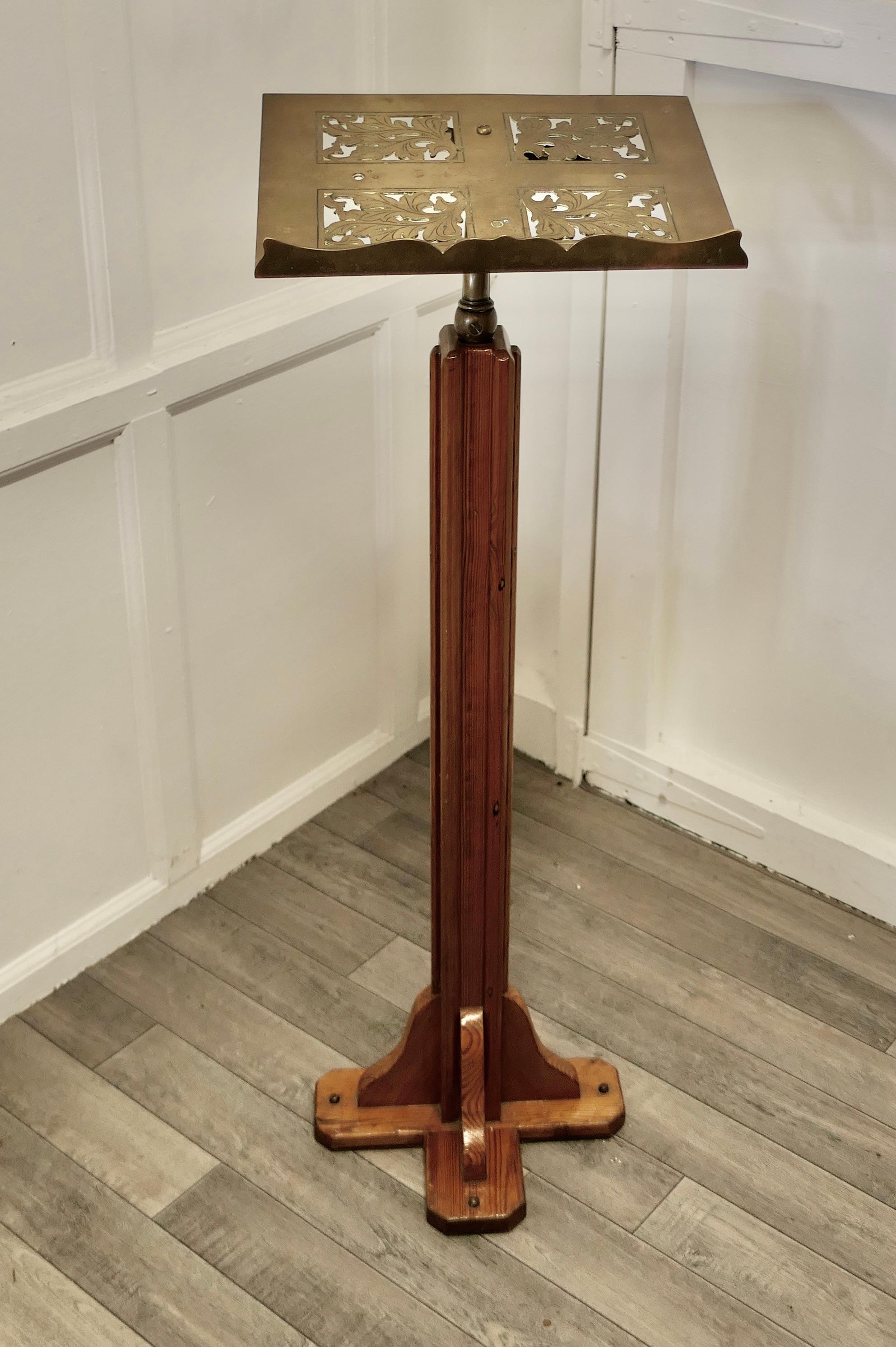 Arts and Crafts Menu Podium, Maître d' Stand

This is a charming piece full of character, the pierced brass book frame at the top is decorated with Oak Leaves and is slightly tilted it is a good size to hold menus
The Stand is set on a chunky X