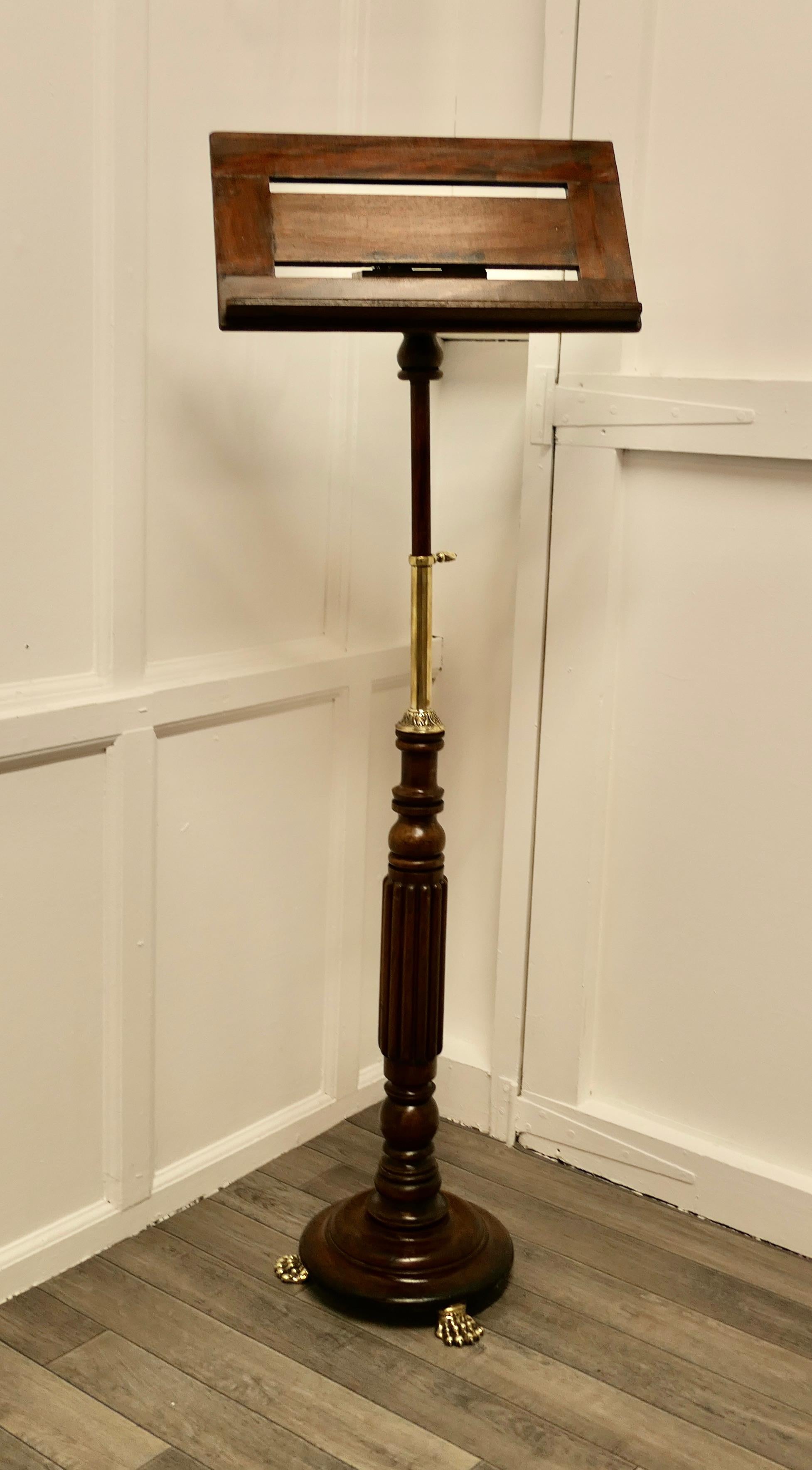 Arts and Crafts Menu Podium, reading stand

This is a charming piece full of character, the book frame at the top tilts from horizontal upwards and it is a good size to hold a menu 
The Stand is set on a turned base with Brass claw feet and the