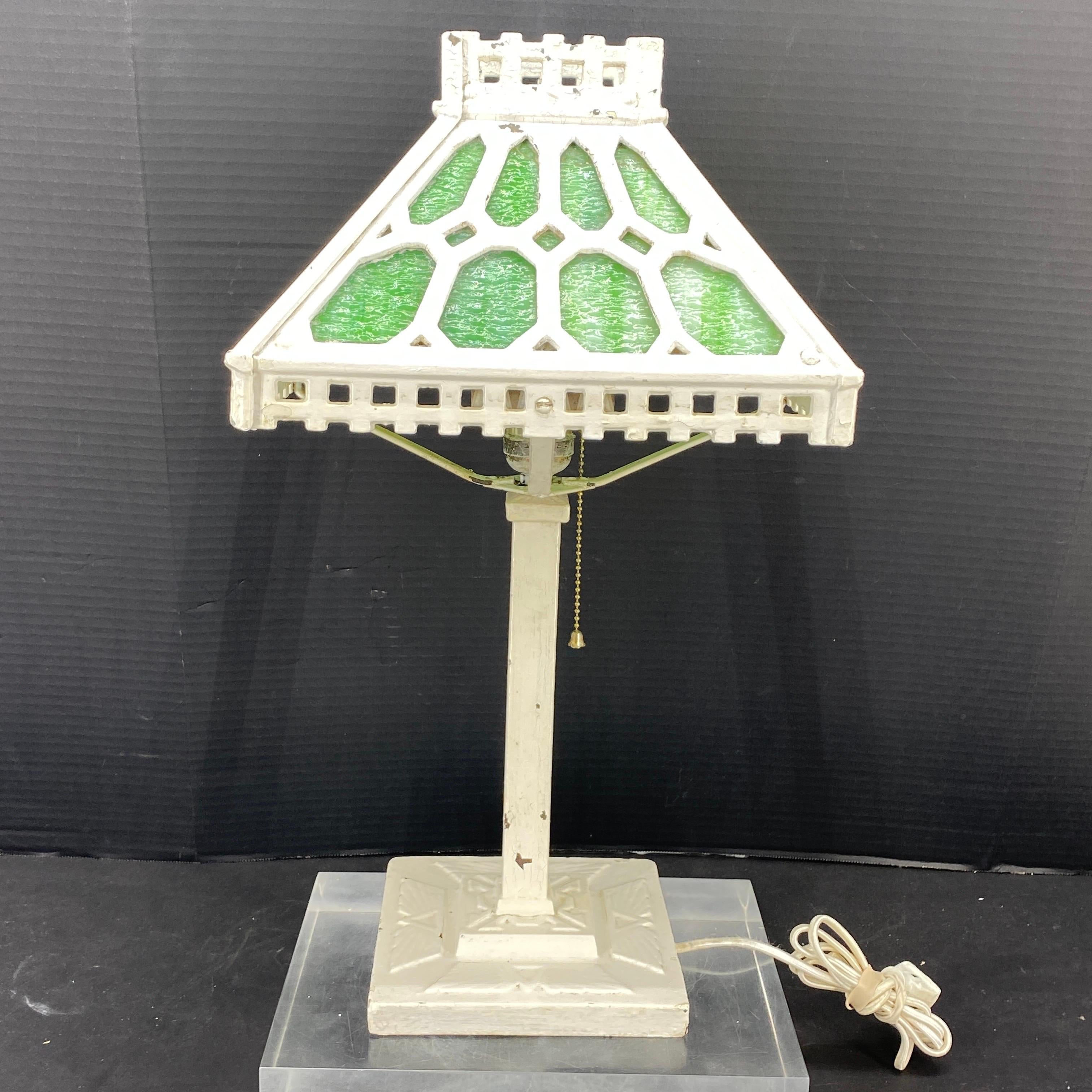 Impressive Bradley and Hubbard Green Slag Glass And Iron Table Lamp. We found this sturdy lamp as is, it appears to be repainted white at a later time. We think it may have been black in its original condition. This table lamp offers an elegant,